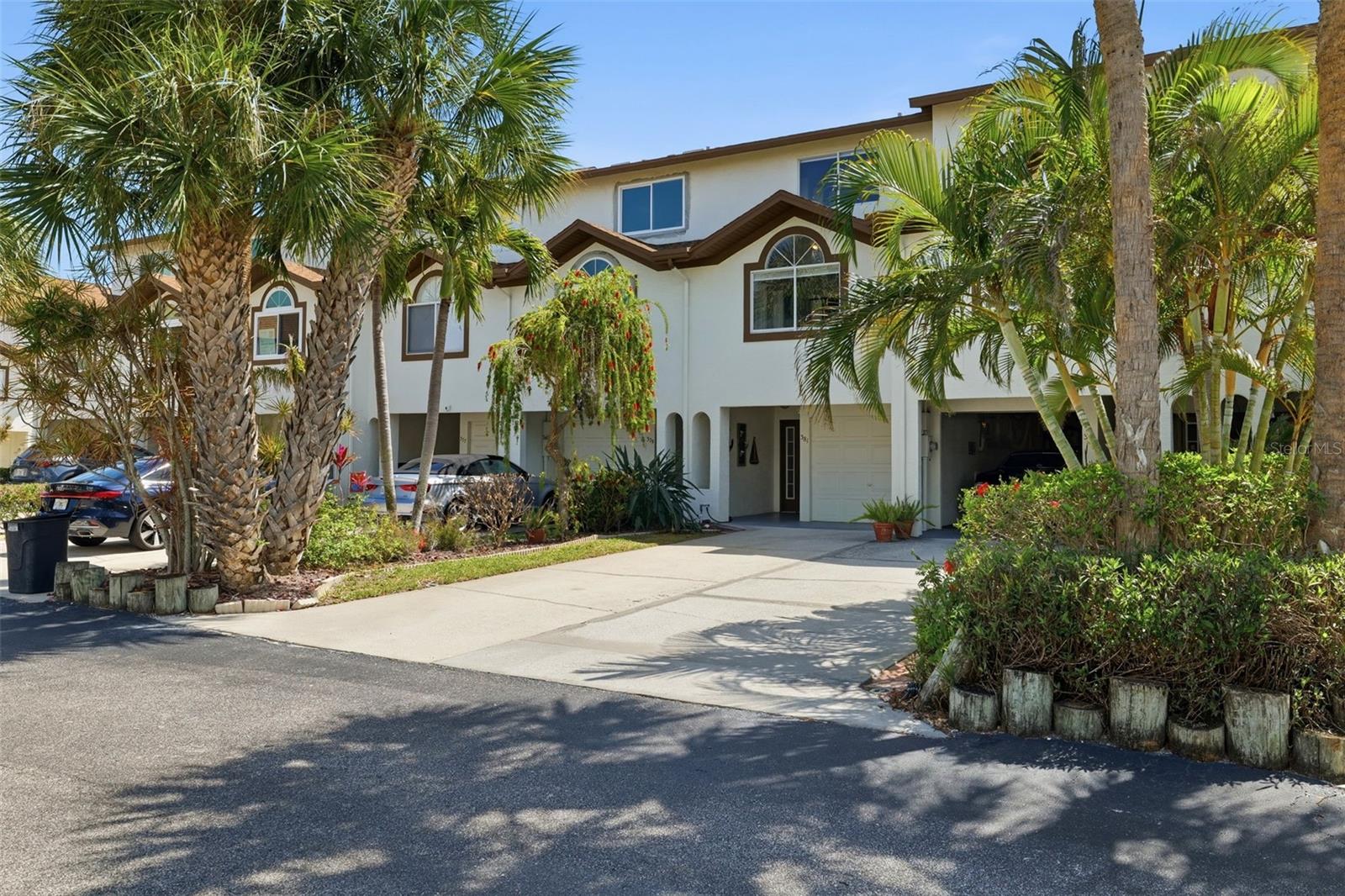 Welcome to your coastal retreat in the highly desirable Tierra Verde community, just minutes from the award-winning beaches of Fort De Soto Park. Known for its pristine shoreline, scenic trails, and laid-back island lifestyle, this location offers the perfect blend of tranquility and convenience.

This beautifully maintained three-story townhouse offers both space and functionality. The ground level features an expansive tandem three-car garage, or a two-car setup with a dedicated workshop—ideal for hobbies, storage, or additional workspace.

The second level showcases a bright and open-concept living, dining, and kitchen area—perfect for entertaining or everyday living. This level also includes a fully updated bathroom with brand-new porcelain tile, vanity, mirror, and toilet, along with a laundry area and a versatile office or guest bedroom.

Upstairs on the third level, you’ll find the spacious primary suite featuring new luxury vinyl flooring and a private balcony with freshly stained wood flooring—perfect for enjoying morning coffee or evening breezes. An additional guest bedroom with new luxury vinyl flooring and a fully renovated bathroom complete this level.

Additional upgrades include interior paint (October 2022), a water softener (2022), and a brand-new AC unit, providing comfort and peace of mind for years to come. Notably, the property experienced no flooding during recent storms, including Hurricane Helene and Hurricane Milton, offering added confidence in its resilience.

Experience coastal living at its finest in one of St. Pete’s most sought-after island communities.
