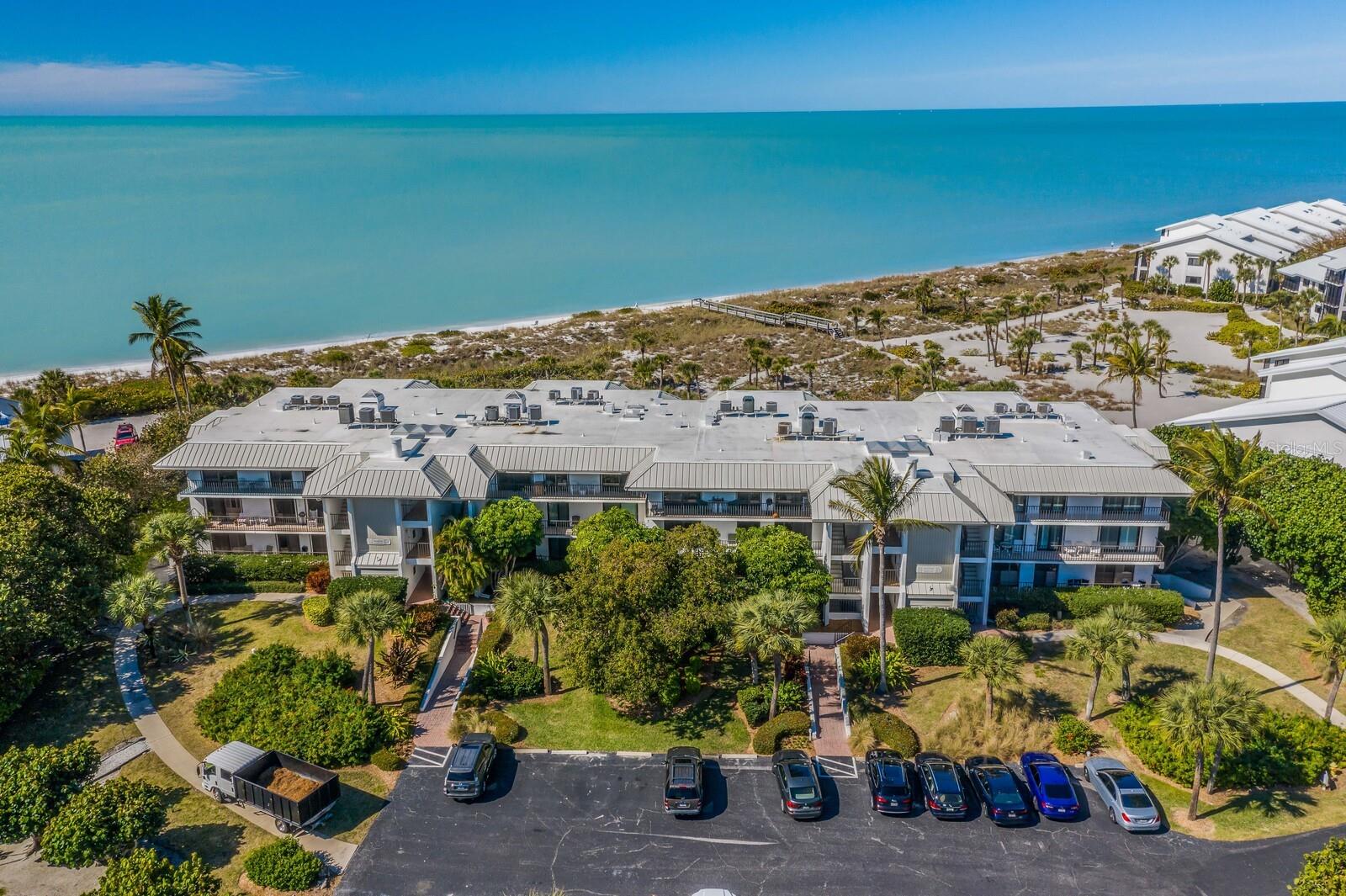 One or more photo(s) has been virtually staged. Enjoy endless Gulf of Mexico views from this top floor beach front condominium, which lives like a spacious home, offering 3 large en suites, high ceilings, elevator access and a private pool for the 12 owners of this building only. Admire the stunning sunsets from your living room, master bedroom or guest bedroom and enjoy your morning coffee watching the sunrise over the bay from your east facing balcony. With almost 2800 square feet under air there is ample room for family and friends and multiple living and dining areas. Lots of closet space and a private garage large enough for a car and a golf cart. Located within the Boca Grande Club, a private gulf front community with numerous amenities including beach, pools, tennis courts, fitness center and Gulf front dining room. This property has been virtually staged, including walls, flooring, appliances and furniture.