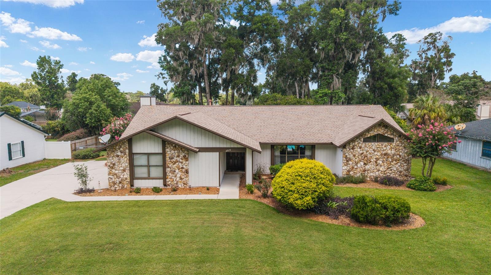 The Heart of SE Ocala nestled on a Private Landscaped lot is this one of a kind 4-bedroom w/ separate office and 
Screened Pool Home. This Traditional beauty features, Living Dining and Family Rooms with Big Windows that 
floods the home with natural Light. Adorned with Handsome Hardwood & Custom 20" Tile Flooring. The Floor 
plan flows beautifully from one room to the next with Cathedral & Vaulted Clgs. The Kitchen & Family Room at 
the center of it all. Featuring Chefs Kitchen with natural gas Range with 5 Burners & Convection Oven. Beautiful 
White Shaker Cabinets with Soft Close & Lazy Susans. Granite Countertops Galore and Adjacent Dining Nook. 
Spectacular Pool and Family Room views with Gas Log Fireplace focal point, in the warm and inviting Family Rm. 
Glassed French door leads to Office/Flex room, Light & Bright, suitable for so many purposes. In the Guest 
bedroom bath and laundry rm wing, you will find large bedrooms with ceiling fans & light Fixtures, and access to 
pool from bathroom & bedroom. Dreamy Primary suite boasts cathedral clgs, Pool Views, huge walk in Closet, 
Dual Vanities and Walk in Shower. Over 1600 Sq Ft Outdoor Entertainment area with Custom Screen Pool & 26 Ft 
Covered Lania area. Surrounded by mature landscaping creating privacy & tropical setting. Extra storage with 10 
x 14 Shed, along with Oversized Side entry 2 Car Garage, and more than ample parking for Guest. On a Beautiful 
quiet but friendly street. Close to all the amenities, restaurants, shopping, parks and medical.
Improvements include the following: Kitchen, Roof 2015, Pool surface 2017, Painting and Garage Door 2021
Water Heater 2023, Pool Screen 2024, septic Pumped 2024, Refrigerator and Dishwasher 2025. Gas Hook up for 
Portable Generator.