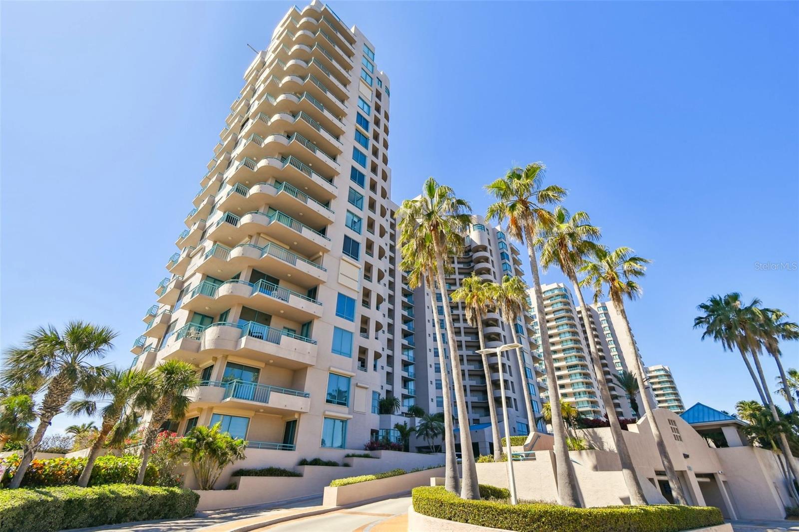 Exquisitely renovated beachfront two-story Plaza level condo offering modern coastal elegance, high-end finishes, and breathtaking gulf views--an exceptional turn-key seaside retreat! This rarely available corner unit provides an unparalleled lifestyle with over 6,800 square feet of combined indoor space & private, outdoor living on the wrap-around terrace and balcony, all with breathtaking Gulf views. Inside, the open and spacious floor plan, featuring high ceilings & designer lighting, creates a warm and inviting space for both relaxation & entertaining. The unit offers 4 bedrooms & 4.5 bathrooms, Control4 smart home & wet bar area with 2 beverage refrigerators. The kitchen is a culinary delight with quartz countertops, high-end stainless-steel appliances, custom cabinets, and a breakfast bar. The primary suite is a private sanctuary with a Gulf front balcony, a large sitting area, 2 custom walk-in closets and spa-like baths featuring dual quartz vanities, a colossal jetted tub, dual water closets with Toto toilets, a new oversized steam shower and tile & marble flooring throughout all baths. This residence also includes a brand-new private elevator. Enjoy direct access to the beach & pools via patio walkways for seamless indoor/outdoor living, and a private two-car garage. Ultimar III on Sand Key Beach embodies five-star resort-style living & offers a lifestyle of luxury with amenities such as on-site management, 24-hour security, gated entry, 3 heated pools with spas, tennis & basketball courts, a putting green, pickleball & croquet courts, an outdoor kitchen, dining areas, fire-pit, lush landscaping, a state-of-the-art fitness center with spa, locker rooms, steam room, sauna, and showers. Social & recreational opportunities abound with a library, a social area with a full kitchen & media center, a business meeting room, and a billiards room. The building’s two-tiered lobby provides a grand entrance with expansive views. Enjoy the convenience of nearby restaurants, shops & salons. Take advantage of the Beach Trolley located right outside for easy access to Sand Key Park and Clearwater Beach. Sand Key Beach offers an exclusive & sophisticated coastal living experience. Detailed list of upgrades available on request. Seller financing available.