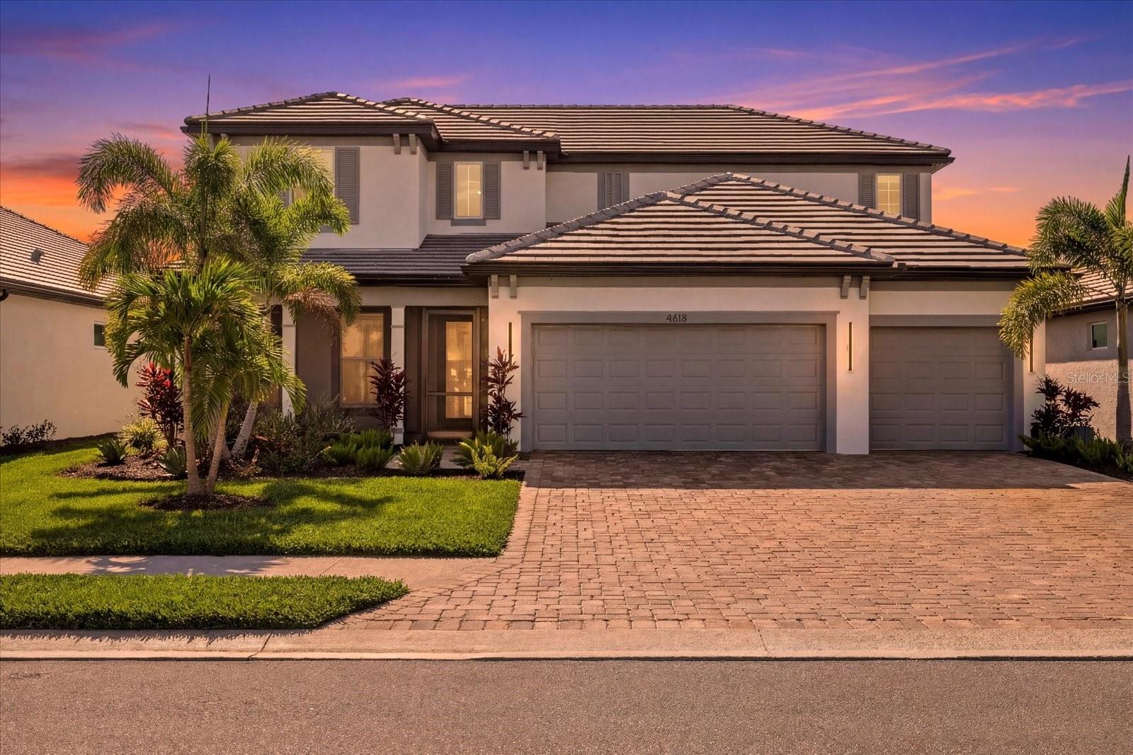 Welcome to Sweetwater at Lakewood Ranch. Built in 2024 by M/I Homes, this highly upgraded Juniper floor plan offers 4 bedrooms, 3.5 baths plus den, 3,697 sq ft, a 3-car garage, full impact windows, upgraded spray foam insulation throughout, and one of the community’s most private premium lots with expansive water and preserve views plus stunning sunset backdrops.

Designed for luxury living and entertaining, the open-concept floor plan features a spacious great room with custom ceiling woodwork details, wide plank flooring, and oversized sliders opening to the covered lanai. The gourmet kitchen showcases a massive island, Cambria quartz countertops, gas cooktop, built-in appliances, abundant cabinetry, walk-in pantry, and extensive storage.

The screened front porch adds additional outdoor living space, while the rear lanai with motorized screens overlooks the resort-style saltwater pool and spa with panoramic lake and preserve views.

The first-floor primary suite features tray ceiling woodwork details, a spa-inspired bathroom with dual vanities, oversized walk-in shower, freestanding soaking tub, designer finishes, and a custom built-in closet system. A dedicated office is also located on the main floor. Upstairs offers three additional bedrooms, including one with a private en suite bath, plus a massive bonus/flex space ideal for a gym, media room, playroom, or second living area.

Additional upgrades include custom woodwork accents, upgraded insulation for energy efficiency, custom closet systems, impact glass throughout, premium finishes, and an oversized 3-car garage.

Sweetwater residents enjoy resort-style amenities including a clubhouse, fitness center, resort pool, playground, tennis courts, and lawn maintenance included. Prime location zoned for the new Lake Manatee K-8 School and future zoned for the new Lakewood Ranch High School/Rangeland High School opening for the 2027-2028 school year. Conveniently located near the Lakewood Ranch Library, Premier Sports Campus, and the new Aquatic Center coming soon.

Rarely available, this Juniper floor plan combines newer construction, privacy, preserve and water views, luxury pool living, energy-efficient upgrades, and an unbeatable Lakewood Ranch location