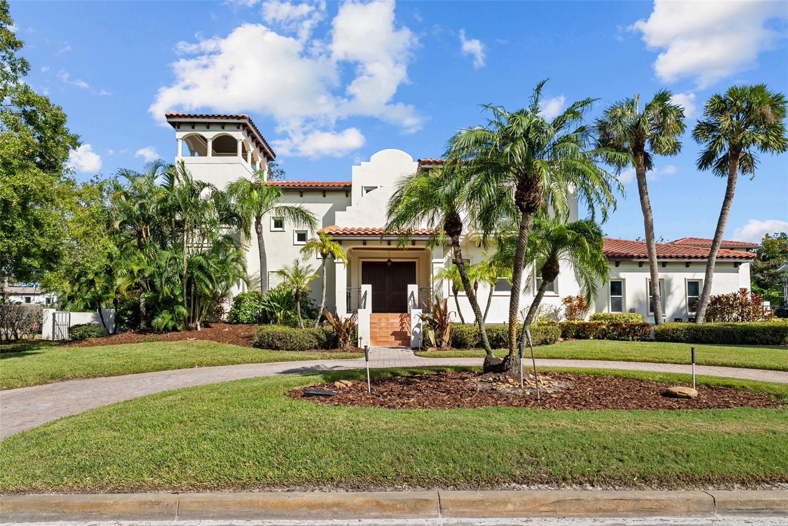 Welcome to this exquisite custom-built residence situated on a corner lot of nearly half an acre (130x165) in one of Tampa’s most desirable neighborhoods. This remarkable home is built to be "hurricane resistant" using polystyrene concrete construction which is also energy efficient. As you step inside the magnificent double doors into the two story entry, you will find a spacious home with chef’s dream kitchen, complete with stainless steel appliances, a NEW WOLF gas range, and a separate walk-in pantry. The cozy breakfast nook overlooks a sparkling pool, making it the perfect spot to enjoy morning coffee. The first floor also includes a large dining space, two living spaces, a media/bonus room & office along with a full bathroom, and large screened in patio. The second floor houses four well-appointed bedrooms, including a lavish master suite, large den with built ins and desk, and laundry room. Additionally, a sprawling 600 sq ft balcony provides breathtaking views of the pool and expansive backyard—ideal for relaxation or entertaining. The large side entry driveway with electronic gate leads into an oversized 3-car garage adding to the convenience, privacy, and security of this property. The guest house boasts over 1,700 sq ft of space, featuring 1 bedroom, 2 full baths, full kitchen, washer and dryer, and a charming patio that overlooks the inviting pool. Other features include an sprawling backyard, large pool and spa, separate pool bath, hurricane impact windows throughout AND a scenic tower offering panoramic views of the surrounding area. With extensive outdoor patios, a luxurious pool and spa, and a lush backyard, this property is perfect for family gatherings and entertaining friends. Don’t miss the opportunity to own this stunning South Tampa gem! *The main house and guest house did not sustain any storm damage*