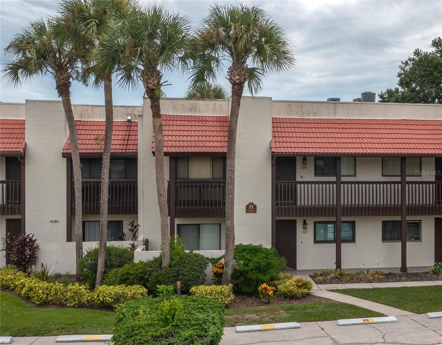 PRESENTING A BEAUTIFULLY FURNISHED 2 BD/ 2 BA condo with soaring cathedral ceilings and beautiful sunset views across a peaceful lagoon with fountain. This well-maintained residence features an open floor plan that seamlessly connects the living areas, dining and kitchen providing ideal space for both entertaining guests and everyday living. The lengthy Florida room has ideal space for a home office. The primary bedroom boasts a walk-in closet, sliding glass doors to the Florida room and a private bathroom. The guest room has a balcony with view of the golf course and the guest bathroom includes a tiled stand-up shower. A utility closet houses the washer/dryer plus there is a large storage closet. This serene Country Club Village offers a community clubhouse with a heated pool and hot tub. Lake Wales Country Club membership is optional to enjoy the Donald Ross designed 18 hole championship golf course, pro-shop, restaurant, lounge and tennis courts. Additionally, this Central Florida location offers convenience for local needs and just an hour from Tampa or Orlando and 1½ hours from either coast for the beaches. This Move-in Ready home is ideal for personal use or as an investment property, this condo will sell quickly, so call for a viewing today!