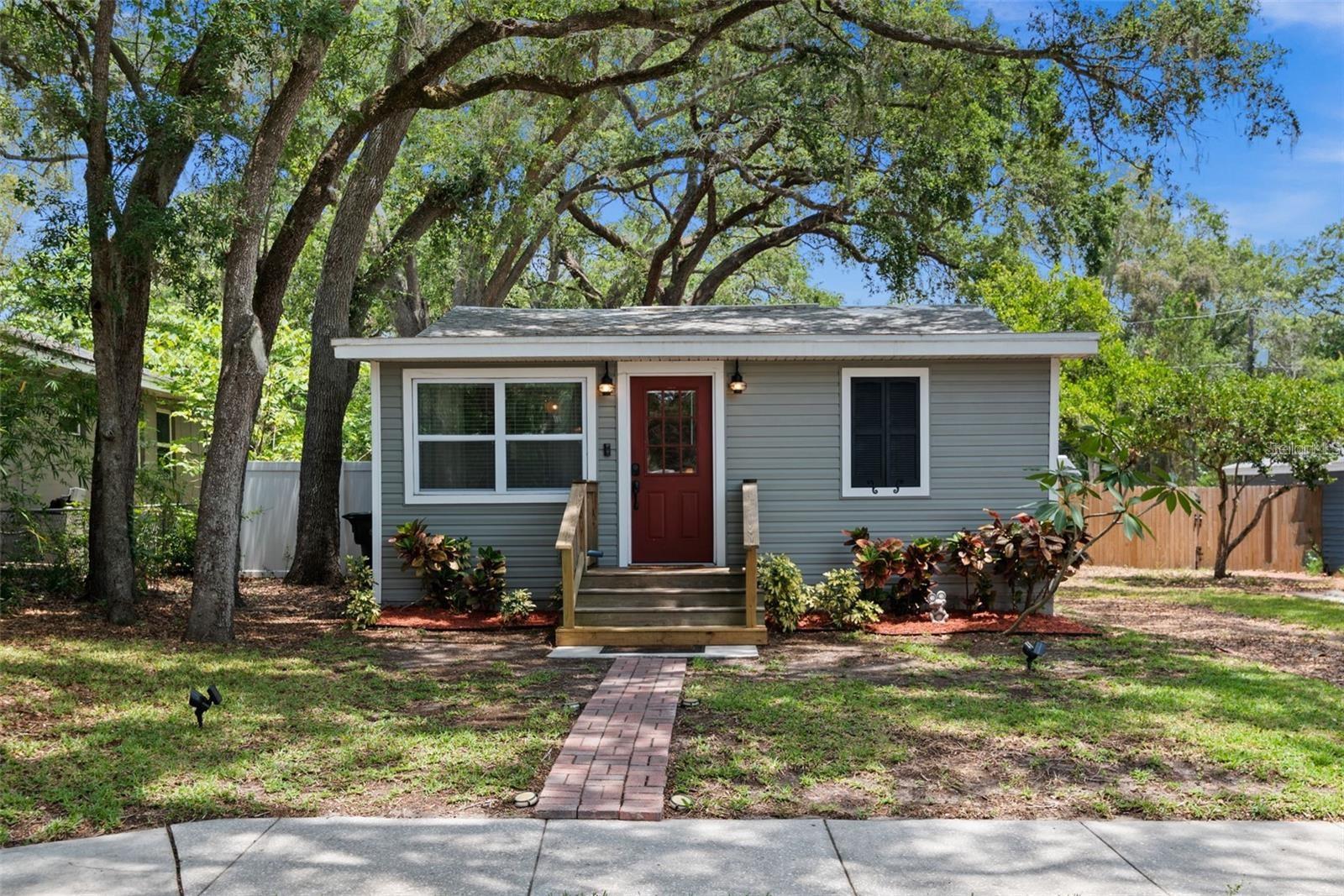 Charming renovated 3-bedroom cottage in a central location — the beach is only 10 minutes away! This move-in-ready home packs serious value into a smart, functional layout. The heart of the home is a galley kitchen finished with shaker cabinets, granite counters, and stainless steel appliances, while durable Luxury Vinyl Plank flooring carries through the entire home — perfect for sandy feet, pets, and everyday Florida living. A cleverly designed half bath doubles as the indoor laundry room and houses the water heater, keeping every square foot working for you. Generous living and dining spaces adapt easily to however you live.
Big-ticket items were all addressed in a comprehensive 2016 renovation: updated electrical and plumbing, AC, added insulation in the walls and attic, vinyl siding, and impact-rated windows (Energy Star, dual-pane, Low-E, rated for the High Velocity Hurricane Zone). The result is an efficient, thoughtfully upgraded home from top to bottom.
Out back, a vinyl privacy fence surrounds the yard with an eight-foot side gate — bring the boat, the RV, and the dogs. The patio is made for weekend cookouts or a quiet evening glass of wine. The lot backs up to the alley, so rear access is an easy option if you ever want it, and there's a storage shed plus enough room to add a garage down the road. Schedule your private showing today.