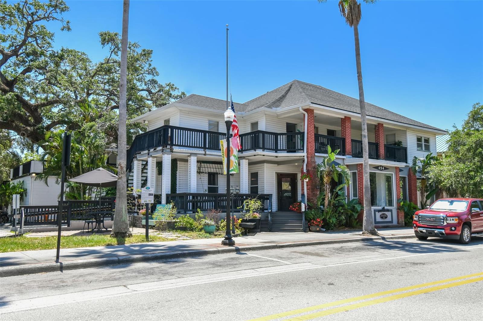Under contract-accepting backup offers. We are proud to exclusively market for sale Harbor Inn on Main, a rare generational asset located in the heart of one of America's most celebrated small towns. With 155 feet of frontage on vibrant Main Street—recently ranked #10 Best Main Street in the U.S. and #5 Best Small Town in the South by USA Today—this mixed-use property offers unmatched charm, versatility, and income potential. Built in 1918 and meticulously maintained, the property features 9,605 SF under roof and 2,599 SF of balcony space. Zoned Main Street Marketplace (MSM), this historic gem supports a wide variety of permitted uses including retail, multi-family, office, hospitality, and entertainment. Currently operating as a hybrid LTR/STR top-rated Airbnb Superhost with (8) turnkey apartment units—(6) one-bedrooms and (2) studios—each with full kitchens and baths. This income-generating property is perfect for investors or owner-occupiers. An opportunity also exists to expand with a 9th additional unit or owner/manager’s suite. The ground-floor retail space is elevated above street level and flooded with natural light, offering excellent visibility and a welcoming Main Street presence. Total retail square footage is equal to 2,983 SF and is currently rented month to month offering flexibility for an owner operator to occupy or generate longer term income. Recent capital improvements include a new roof (2020) on the primary building and new HVAC with ductwork (2023) in the retail space. Additional highlights: 14 private parking spaces, Garage/storage space, Located in Flood Zone X, Just blocks from the iconic Safety Harbor Spa, Two majestic “Great Oaks” on site, Steps away from the lively Third Friday Street Festival—a monthly downtown celebration of music, art, food, and community. This is more than a property—it’s a piece of Safety Harbor history with modern upside. Contact us today for details or to schedule a private tour.