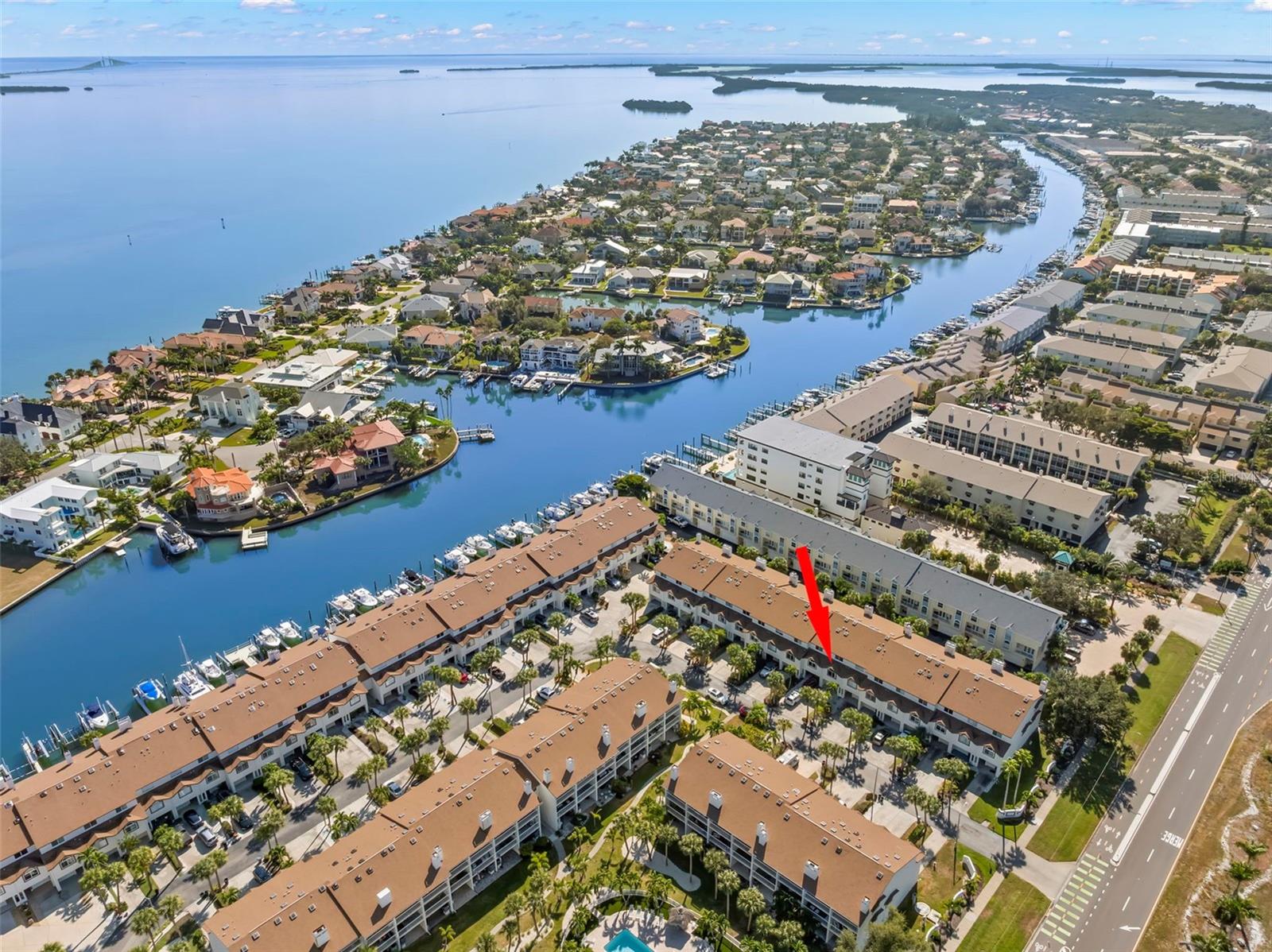 This is what you move to Florida for! A beautifully appointed three-bedroom, three-bath townhome in Tierra Verde's coveted Palms of Tierra community — steps from the Gulf, minutes from downtown St. Pete, and built around the kind of indoor-outdoor living most buyers spend years searching for. From the moment you step inside, you'll feel it: sun-drenched living spaces, soaring vaulted ceilings, and an effortless open-concept flow made for both lazy Sundays and lively gatherings. Cozy up beside the wood-burning fireplace on cool winter evenings, or slide open the doors and let the Gulf breeze roll in from your private covered balcony — cocktail in hand, not a care in the world.
The kitchen is built to entertain, with generous cabinetry, stainless steel appliances, and a breakfast bar that keeps the conversation flowing. Every bedroom is a private retreat, each featuring an en suite bath, vaulted ceilings, and custom built-in closets. The expansive primary suite takes it even further — soaring ceilings, a walk-in closet, a skylight-kissed en suite bath, and its own covered balcony where every morning feels like a vacation. Downstairs, an oversized tandem 2-car garage gives you room for all the toys — paddleboards, bikes, and kayaks — plus direct access to yet another covered outdoor space ready-made for weekend barbecues and golden-hour hangs. And your four-legged family members? They'll love it here just as much as you do. This is a pet-friendly community, and at the very tip of the island, the legendary Fort De Soto Dog Beach — consistently ranked among the top dog beaches in the entire country — is practically in your backyard. Miles of off-leash shoreline, warm Gulf waters, and tail-wagging bliss await, just minutes from your front door. Beyond the leash-free adventures, Fort De Soto Park, scenic waterfront trails, boat ramps, and marinas round out a backyard that most would only dream about. Award-winning beaches, waterfront dining, world-class fishing, and the electric pulse of downtown St. Petersburg are all just minutes away. Resort-style amenities — pool, hot tub, fitness center, tennis and pickleball courts — complete the picture. Unbeatable location. Zero compromises. Move-in ready. THIS IS THE TIERRA VERDE LIFESTYLE - COME LIVE IT. This home had ZERO water intrusion during the hurricanes of 2024.