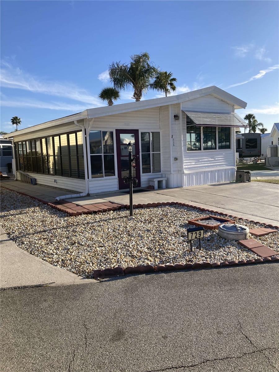 NO LOT RENT YOU OWN THE LAND This 22 x 35 mobile home features one bedroom one full bath large Florida room glass in with heat and air-conditioning this home has all new pecks, plumbing, new appliances, newer rubber roof wide driveway for two cars, newer water heater, washer and dryer. This home comes furnished as seen the park has many amenities, including the clubhouse to swimming pools, tennis courts, Pickleball courts, miniature golf and many activities for seniors and the snowbirds don’t miss out on this great buy. This park has 24 hour gated security one pet allowed, buyers must pass background and credit check this home can be viewed anytime by appointment.