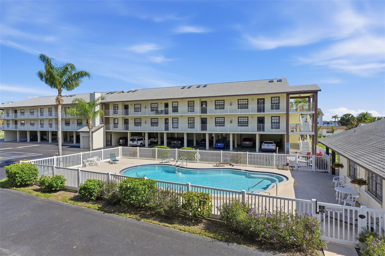 Welcome to this inviting two-bedroom, two-bathroom condo in Harbor Point West, ideally located on the scenic Dunedin Causeway and just moments from the waterfront lifestyle that makes Dunedin so desirable. Offering a bright and functional layout, this condo is perfect for enjoying low-maintenance coastal living. Step inside to find wood-look vinyl flooring flowing throughout the main living spaces and an open dining room and living room combination that creates a comfortable space for relaxing or entertaining. The kitchen is conveniently located to the right of the entry and features stainless steel appliances, quartz countertops, and a pass-through window overlooking the dining area for added openness and convenience. The spacious primary suite includes an updated private bathroom with a modern vanity, updated mirror, and a beautifully tiled shower with glass enclosure. The additional bedroom is nicely sized and located near the second full bathroom with a tub/shower combination, ideal for guests or everyday use. A washer and dryer closet is conveniently located on the screened-in porch, creating additional functional space while allowing you to enjoy the Florida breeze. Residents of Harbor Point West enjoy access to a community pool and an unbeatable location close to local dining, shopping centers, golf courses, beaches, and endless water activities including boating, kayaking, and paddleboarding. Monthly fee includes cable tv, sewer, trash, pool maintenance, and more! Just minutes from Downtown Dunedin and the Pinellas Trail, this condo offers the perfect opportunity to experience the best of Florida living. Schedule your showing today!