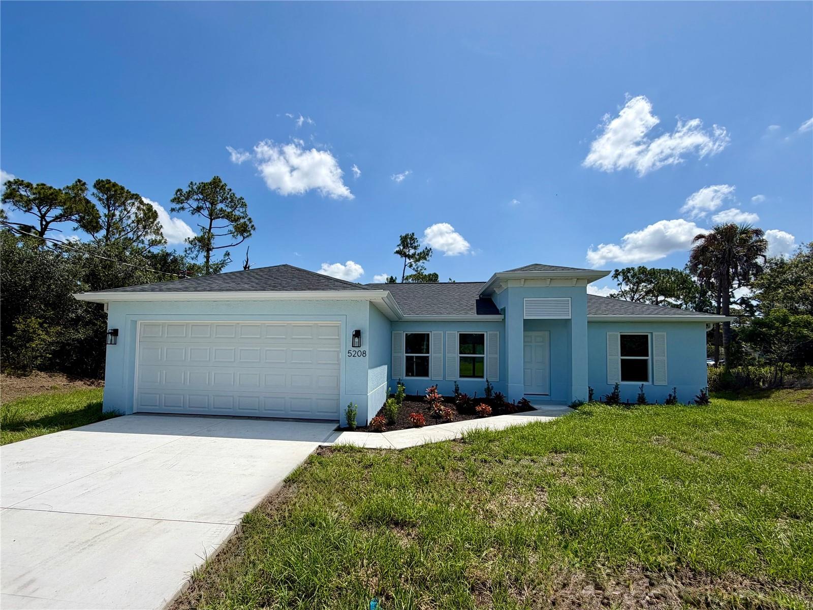 Virtually Staged. BEAUTIFUL NEW CONSTRUCTION HOME on a GREENBELT!

Why settle for a basic "builder grade" home when you can have it all included? This stunning home offers a level of upgrades rarely seen at this price point. Featuring an open, split floor plan with vaulted ceilings, this home is built for both style and long-term savings.

PREMIUM FEATURES INCLUDED: This home is fully equipped with PGT double-pane Hurricane Impact windows and sliding doors, meaning NO shutters are ever needed. You will find 50-year-rated porcelain tile flooring throughout the entire home, including the showers. The chef-inspired kitchen features 36-inch upper cabinets with soft-close drawers and doors, premium granite or quartz countertops, and quality stainless steel appliances.

BUILT FOR SAVINGS AND DURABILITY: Designed to keep your insurance, maintenance, and utility costs at a minimum, this home includes an energy-efficient HVAC system, a 3- or 4-zone sprinkler system and a 30-year shingle roof. The exterior comes fully sodded and professionally landscaped, complete with gutters around the entire perimeter and a fully screened-in lanai for year-round Florida living.

PEACE OF MIND: Move in with confidence knowing your investment is protected by extensive warranties, including a 10-year structural warranty and a 10-year HVAC warranty.

FINANCING BONUS: Our preferred lender is currently offering up to $1,500 in closing cost assistance!