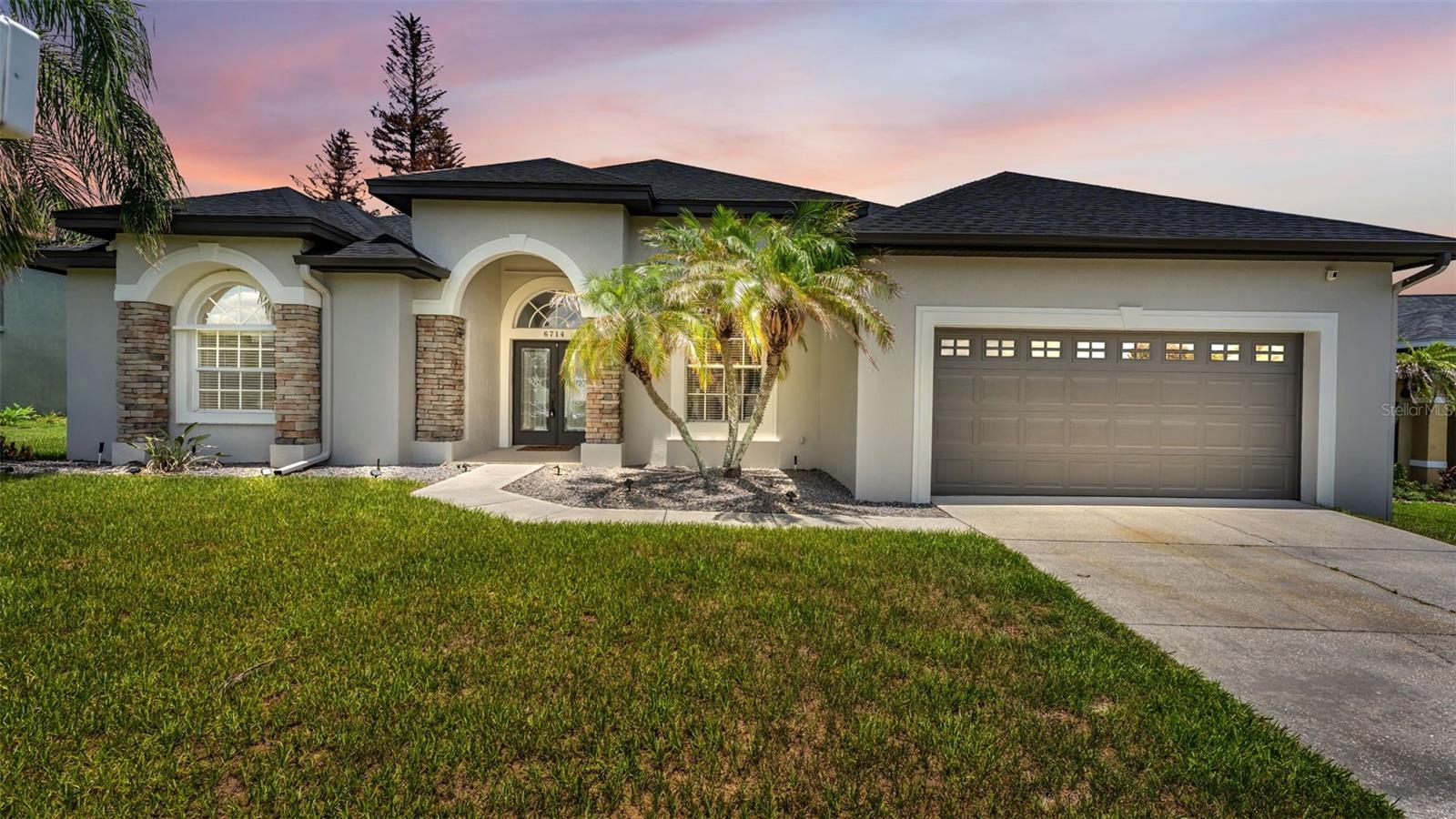Welcome to this exquisitely renovated 4-bedroom, 3-bath pool residence nestled within the highly coveted gated community of Highlands Creek. Expertly crafted by Cassidy Homes, this exceptional property showcases timeless design, refined finishes, and an impressive list of recent upgrades that make it truly move-in ready.
From the moment you arrive, you'll appreciate the home's fresh exterior paint, professionally refreshed landscaping, and brand-new roof, creating outstanding curb appeal. Inside, the home has been thoughtfully transformed with fresh interior paint, elegant luxury flooring throughout, beautifully remodeled bathrooms, and a stunning redesigned kitchen featuring brand-new stainless steel appliances.
Designed with both comfort and entertaining in mind, the spacious split-bedroom floor plan offers soaring ceilings, a formal living room, an elegant dining room, and an inviting family room filled with natural light. The gourmet kitchen serves as the centerpiece of the home, offering abundant counter space, generous cabinetry, and an open view of the breakfast nook and sparkling heated pool.
The luxurious primary suite is a private retreat featuring French doors leading directly to the pool, along with a spa-inspired ensuite complete with dual vanities, a spacious walk-in shower, a relaxing soaking tub, and an oversized walk-in closet.
A privately situated secondary bedroom adjacent to the pool bath creates the perfect guest suite, multigenerational living space, or private home office. Two additional bedrooms and a bathroom spacious laid out.
Step outside into your own backyard oasis where the heated pool provides the ideal setting for year-round enjoyment, whether you're relaxing after a long day or hosting family and friends. Every detail of this home has been thoughtfully updated to provide a seamless blend of elegance, comfort, and modern convenience.
Located in one of Lakeland's most desirable gated communities, Highlands Creek offers the perfect combination of privacy, prestige, and accessibility. This is more than just a home...it's a lifestyle.