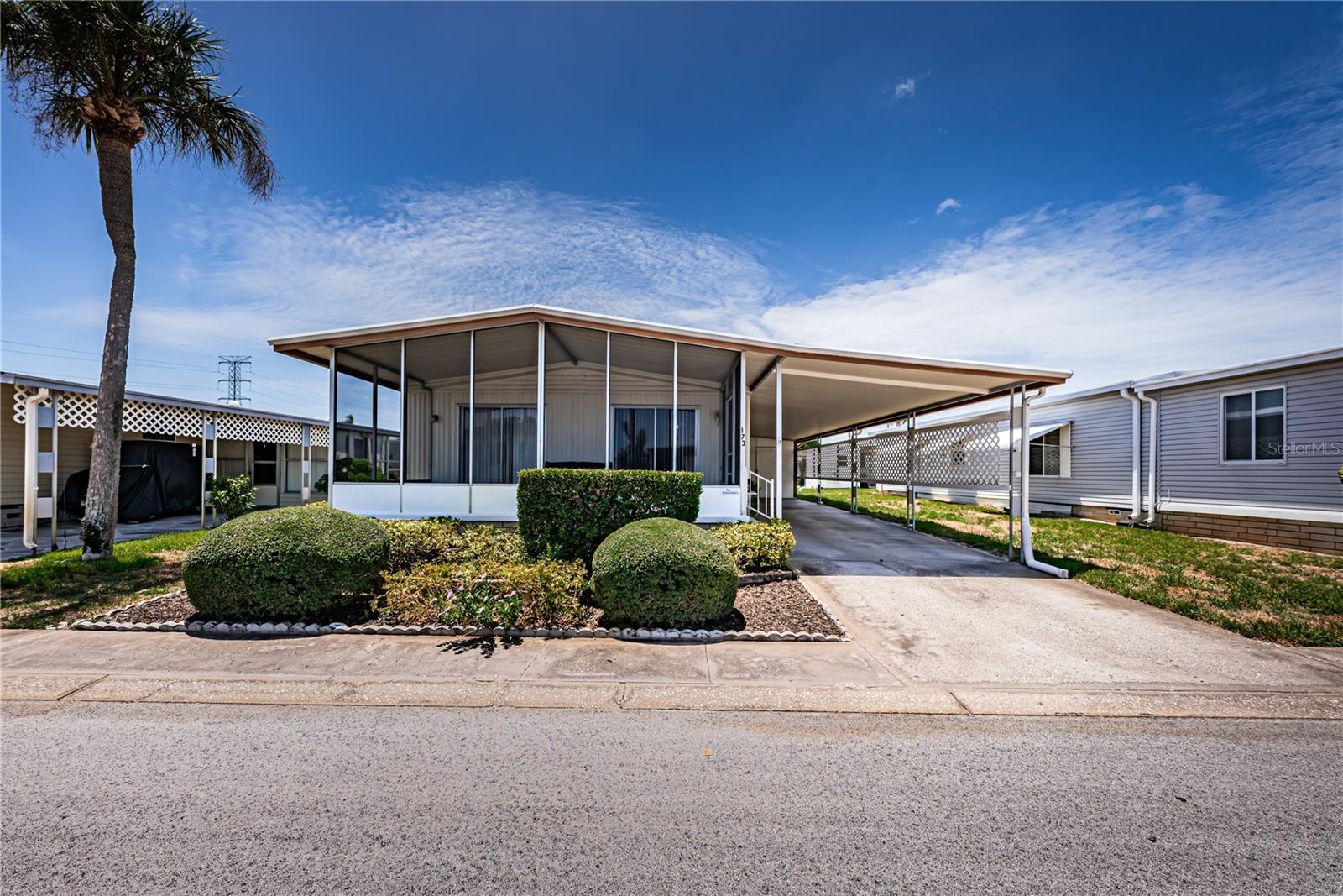 Don't miss this opportunity to own a well-maintained 2-bedroom, 2-bath double-wide manufactured home in Blue Jay Estates, a welcoming and active 55+ community where you own the land—no lot rent! Located in a non-flood zone, this home offers affordable living with a low monthly maintenance fee of just $230, which includes water, sewer, trash, lawn care, and more. Relax on the spacious 23' x 10' screened front porch, featuring two sliding glass doors into the home. This versatile space could easily be enclosed, adding approximately 230 square feet of additional living area. Recent updates include a membrane roof-over, A/C (2021), newer windows, and newer carpeting. The eat-in kitchen offers plenty of storage with two pantry closets, while the unique split-bedroom floor plan provides added privacy. The primary bedroom features a walk-in closet plus an additional utility/storage closet. Outside you'll find attractive landscaping, a long driveway with parking for up to three vehicles, and a storage shed with a washer and dryer and plenty of extra storage space. Blue Jay Estates is known for its active lifestyle, offering a vibrant social club, numerous community activities, a heated pool for year-round enjoyment, shuffleboard courts, and bocce. Residents also have access to a designated storage area for boats and RVs at no additional charge (subject to availability). Conveniently located near beautiful Gulf beaches, the Pinellas Trail, parks, shopping, restaurants, medical facilities, and both Tampa International and St. Pete-Clearwater airports, this home offers the perfect combination of comfort, convenience, and Florida living.
Schedule your private showing today and discover Blue Jay Estates!