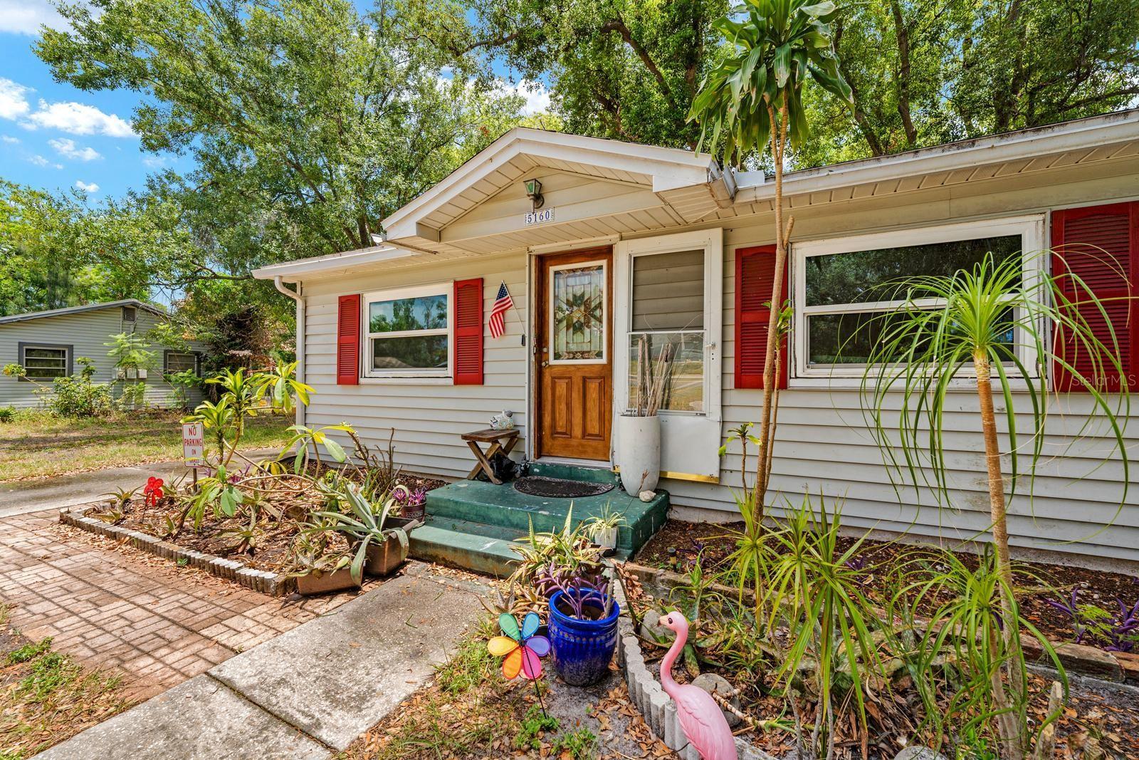 Calling all investors!  Seller says sell this weekend!!! Welcome to this classic single-story Ranch residence located in the Cisney Homes subdivision of St. Petersburg, Florida. Built in 1952, this home is situated on a flat, cleared 0.14-acre homesite within unincorporated Pinellas County. The property features fee simple ownership with the distinct advantage of no annual HOA fees, no community association restrictions, and no minimum lease period limitations.

The exterior showcases straightforward curb appeal with a paved front sidewalk leading directly to the front entrance. Mature shade trees line the front yard, framing a long concrete driveway that offers a parking pad, guest parking options, and access to the attached one-car garage with a 264-square-foot layout.

At the rear, the property features a fully fenced backyard that provides a private outdoor setting for relaxation and entertainment. This outdoor space is highlighted by a concrete rear porch, established shade trees, and an outdoor grill. A brick paver walkway cuts across the lawn, leading directly to a detached wood-frame storage structure equipped with matching trim.

Inside, the home provides 716 square feet of heated living space configured entirely on a single level. The main living room features original wood flooring, a ceiling fan, and a wide cased opening that connects directly into the kitchen. Designed with practical ceramic tile flooring and a dedicated eating space, the kitchen comes equipped with an appliance package including a range, refrigerator, microwave, washer, and dryer. A separate dining room offers an additional gathering area finished with carpet flooring and its own ceiling fan.

The layout features two bedrooms positioned on the main floor, both finished with wood flooring and ceiling fans. They share convenient access to the central full bathroom, which features ceramic tile flooring, a single vanity, an exhaust fan, and a tub-and-shower combination positioned under a bathroom window that pulls in natural light.

Additional features include a central air conditioning system, central heating, and complete connections to public water and public sewer utilities. The property is mapped within a non-flood-hazard Flood Zone X area. Located on a public, asphalt-paved street with street lights, this home sits near public transit routes and provides an easy daily commute to Westgate Elementary, Tyrone Middle, and Dixie Hollins High School.