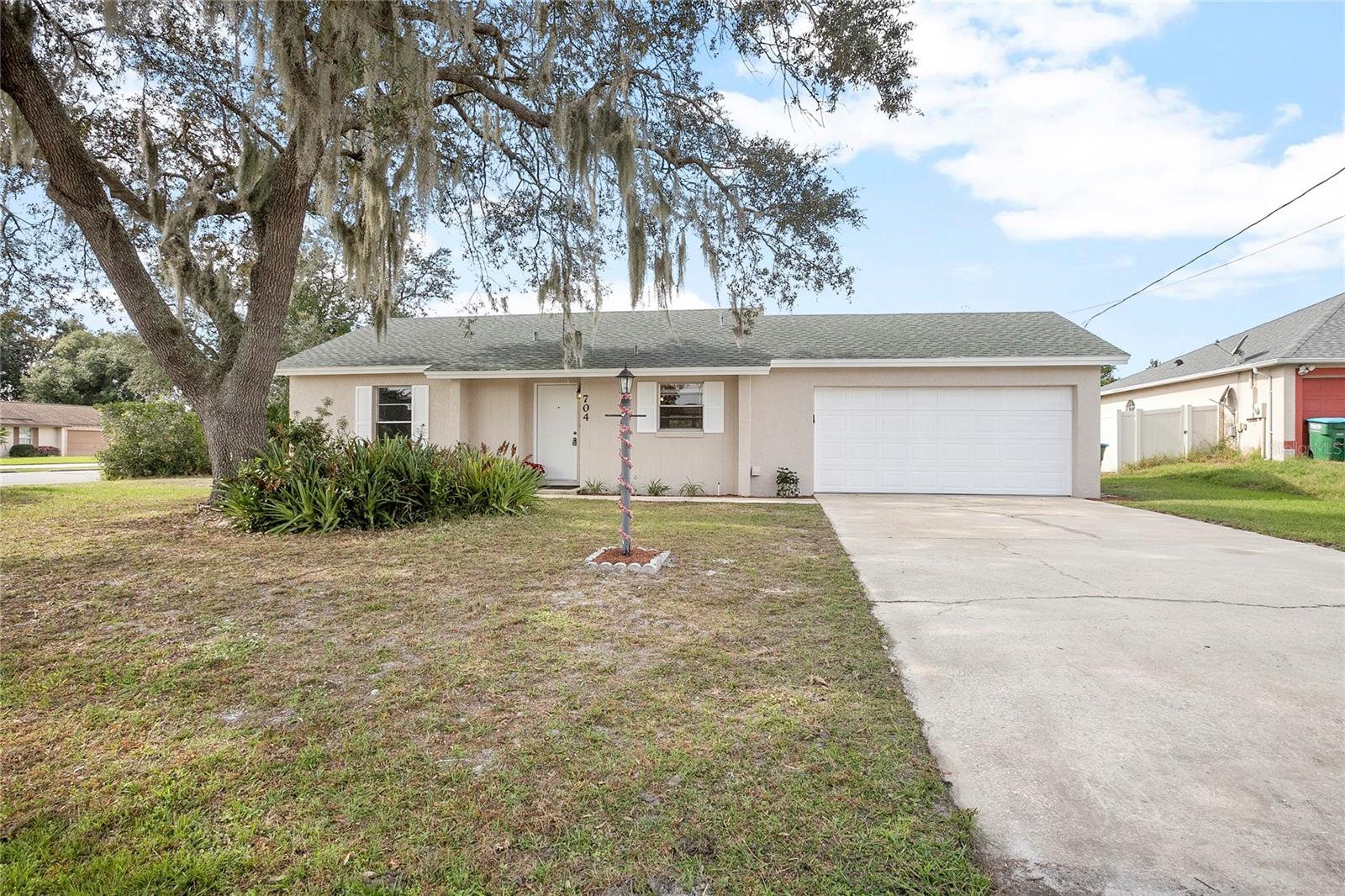 ADORABLE BUNGALOW IN IMMACULATE CONDITION AND READY FOR THE NEW OWNERS!  Home has been freshly painted inside and out, new roof in 2021, new AC in 2022 and updated bathroom.  Home offers two large bedrooms with large great room that is open to the kitchen.  10 x 12 screened porch overlooking large corner lot.  Located in great area of Deltona close to all major roads, shopping and restaurants.  Nothing to do here but grab your toothbrush and bags and move right in!