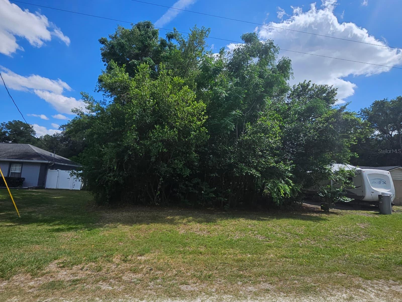 Build-ready opportunity in the growing Summerfieldf area of Marion County. This vacant parcel offers an excellent combination of privacy, flexibility, and long-term potential for either a primary residence, seasonal home, or investment property. Located in a peaceful setting surrounded by Florida’s natural beauty, the property provides a quiet atmosphere while still maintaining convenient access to major roadways, shopping, dining, medical facilities, golf courses, and nearby outdoor recreational activities. The lot presents a great canvas for buyers looking to design and build according to their own vision. Area features a mix of established homes, new construction, and spacious surroundings that continue to attract both homeowners and investors seeking value and future growth in Marion County. Located in paved road and conveniently positioned within driving distance to The Villages, Ocala, Belleview, and surrounding Central Florida destinations. Buyer and buyer’s agent are encouraged to verify zoning, land use, utility availability, lot dimensions, building requirements, impact fees, and any future development plans with Marion County. Excellent opportunity for builders, investors, or end users looking to secure land in an expanding market with strong future upside.
