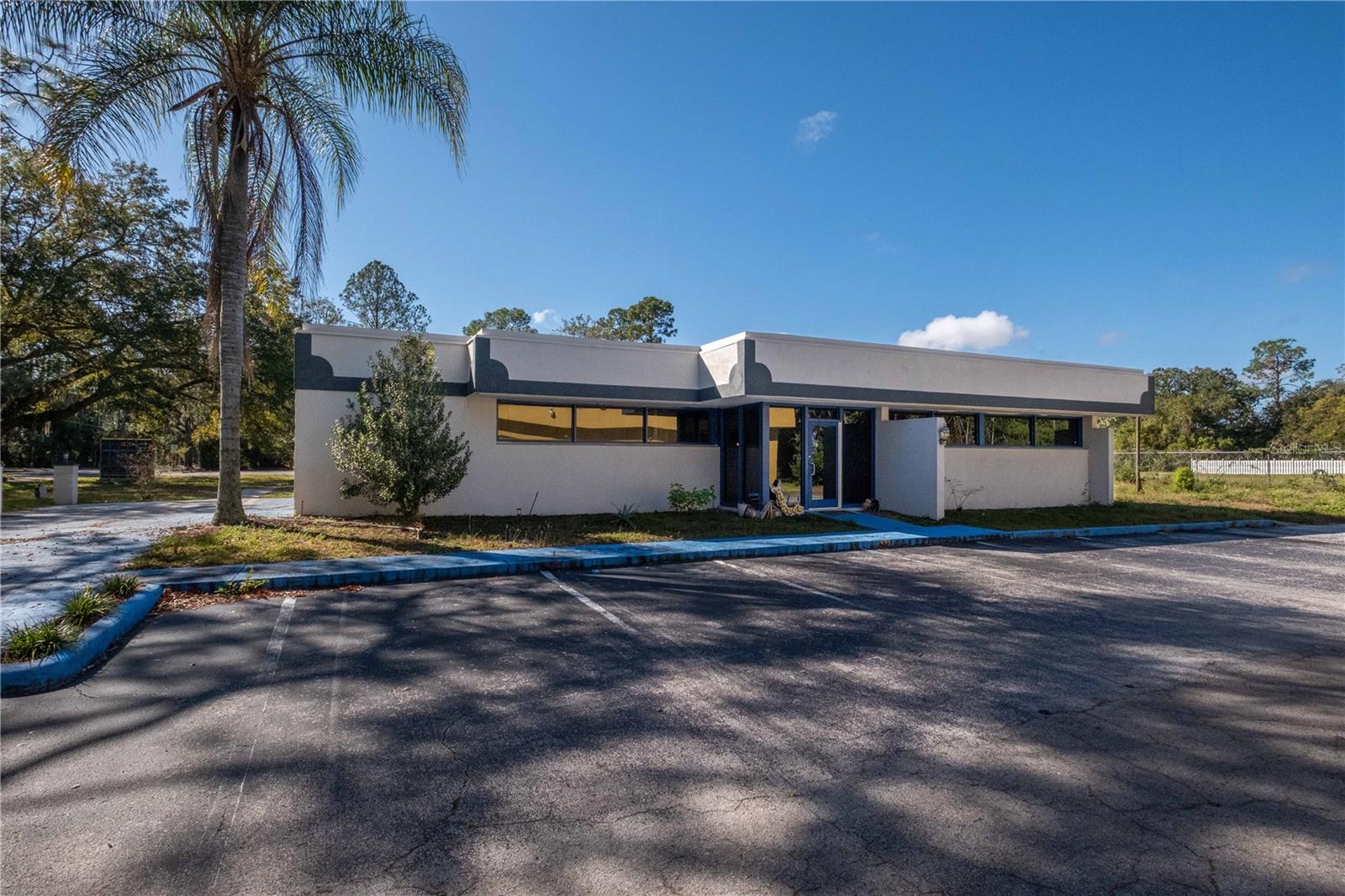 Excellent location! Great stucco retail building divided in 2 separated sections. First section has 3 small rooms and one large room, spacious lobby and waiting area plus another small room for kitchen with 2 bathroom stalls in ladies room and a shower in mens room. Handicap accessible. 2nd section has a separate office with a new built 1/2 bath. The building has 2,173 H/C sq ft on .42 acre