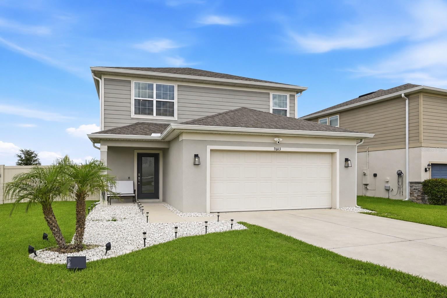 WELCOME TO RIDGEVIEW! This 2022 McNair floor plan offers 4 BEDROOMS, 3 FULL BATHS, 2,177 SQ. FT. and an OPEN-CONCEPT design perfect for everyday living and entertaining. The kitchen features GRANITE COUNTERTOPS, a large island, abundant cabinetry and overlooks the gathering room and dining area. TILE FLOORS throughout the main living areas downstairs, carpet upstairs, a FIRST-FLOOR BEDROOM AND FULL BATH, spacious UPSTAIRS LOFT, convenient upstairs laundry and a CUSTOM PRIMARY CLOSET SYSTEM. Step outside to a SCREENED LANAI overlooking a FULLY VINYL-FENCED .24-ACRE LOT—one of the largest homesites in the community—with plenty of room for a future pool. Additional upgrades include a SMART THERMOSTAT, WI-FI 8-ZONE IRRIGATION SYSTEM, HIGH-EFFICIENCY HVAC and WATER HEATER. PREMIUM LOCATION DIRECTLY ACROSS FROM THE CLUBHOUSE, RESORT-STYLE POOL AND PLAYGROUND. Convenient to shopping, dining, Lake Louisa State Park, the Olympus development and major roadways. THIS ONE CHECKS ALL THE BOXES!