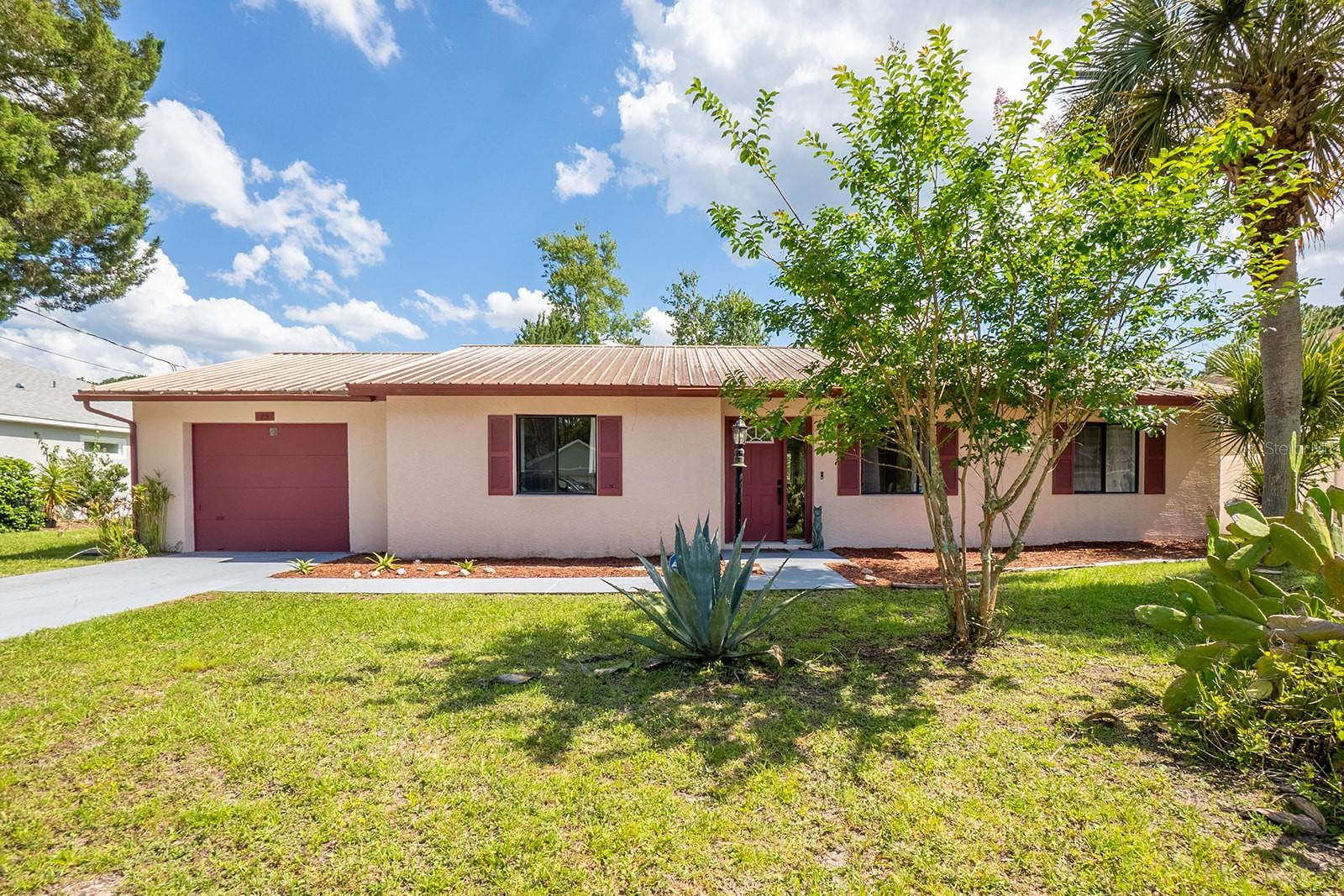 Welcome to this well-maintained 3-bedroom, 2-bath home located in the desirable Cypress Knoll neighborhood. Ideally situated near shopping, hospitals, and schools, with a short drive to local beaches and golf courses, this home offers both convenience and lifestyle. Inside, you’ll find a clean, open split floor plan that provides both functionality and privacy. The spacious living areas flow seamlessly, perfect for everyday living or entertaining. The kitchen and main living space open to a beautiful covered and screened Florida room, complete with windows and a sliding glass door—ideal for enjoying indoor-outdoor living year-round. Additional features include a one-car garage with built-in cabinets for extra storage, a durable metal roof (2011), and a newer AC system (2022). The backyard is ready for your personal touch. This move-in ready home is a fantastic opportunity in a sought-after location.