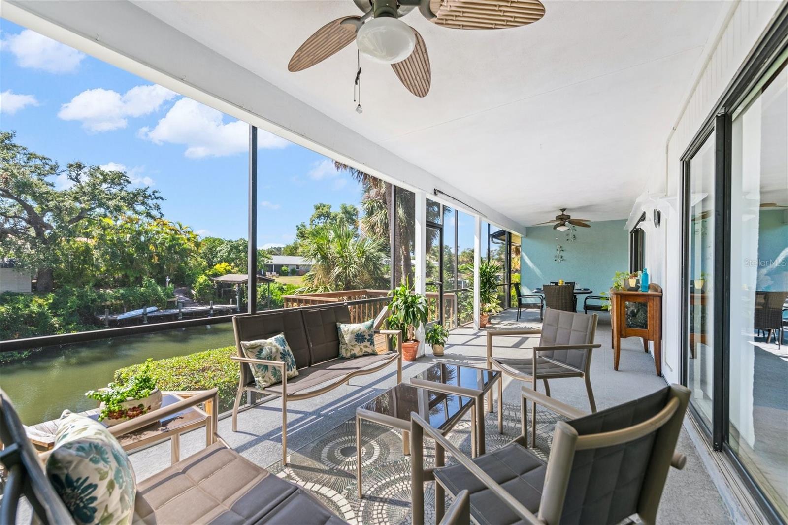 Canal front condo in the popular Schooner Bay gated community of just 36 units. It’s always about the view for an exceptional lifestyle. Enjoy the nearby Siesta Key experience from this 3 bedroom-2 bathroom waterfront residence.  You may also add a lift to the assigned dock at your doorstep with direct access to the ICW to enjoy a coastal lifestyle. There is a private 11x21 garage.  Low HOA fees, pet-friendly, newer roofs, sparkling pool, clubhouse, dual gates to conveniently have access to the nearby shops, restaurants, grocery-all within a quiet park-like setting. There is a private large front paver courtyard patio for morning coffee, BBQ and evening cocktails. The uncommonly large west patio is 10-by-36 feet, overlooking the sparkling canal with access off the Great Room and Owners suite. Main level living condo with spacious rooms and many recent updates in an open concept Kitchen with quartz and Owners Bath with walk in shower and outfitted closet. All rooms are generously sized, the 3rd bedroom has a Murphy Bed and built in desk. Large laundry closet and additional storage closet. Sold partially furnished. Minutes to culturally rich downtown Sarasota, Airport, Farmers Markets and an incredible way of living