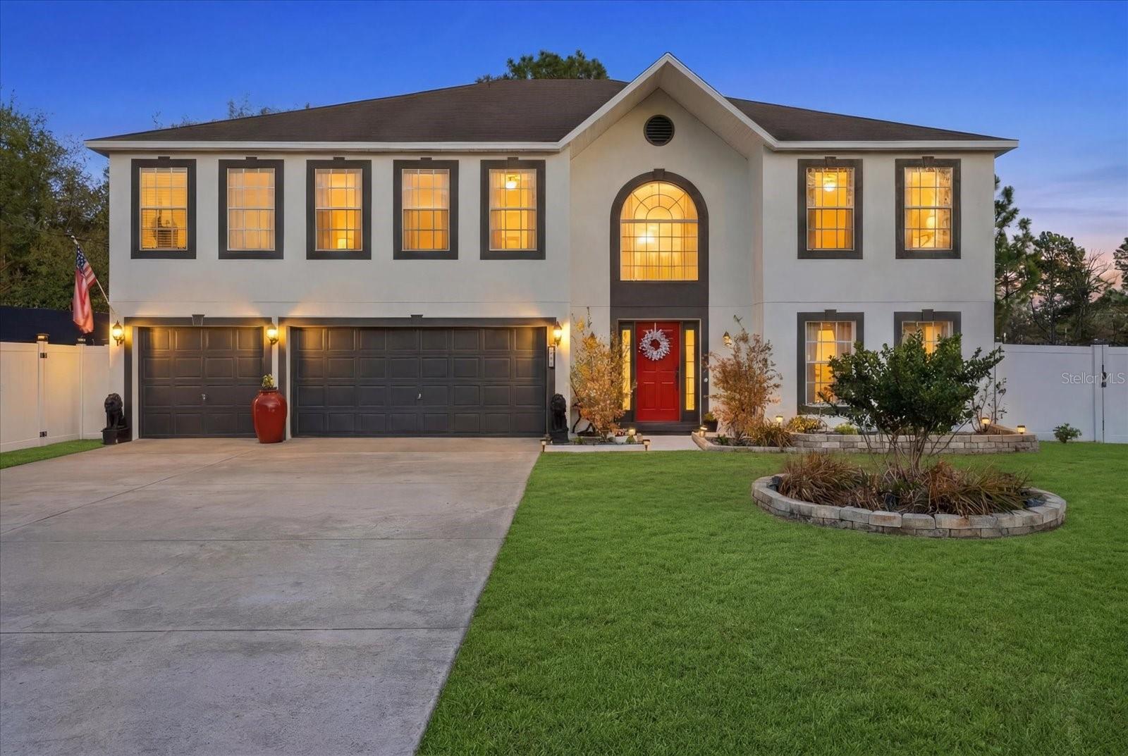Price Improvement! Welcome to 7185 N Farmington Terrace — a stately two-story home offering over 4,000 square feet of thoughtfully designed living space on a .30-acre lot in Citrus Springs.

With its symmetrical façade, arched architectural detail, and striking red front door, this home makes a memorable first impression. Inside, soaring ceilings and an open-to-below design create a bright, spacious feel from the moment you enter.

The main level offers multiple living spaces, including a formal living room, dedicated dining area, and a separate family room — providing flexibility for entertaining or everyday living. The updated kitchen is both stylish and functional, featuring granite countertops, tile backsplash, extended cabinetry, soft-close drawers, dual sinks, a center island, and abundant prep space. A sunny breakfast nook overlooks the backyard, and a mud room just off the garage adds everyday convenience.

A downstairs en-suite bedroom offers an ideal setup for guests, extended family, or multi-generational living.

Upstairs, the spacious primary suite easily accommodates a sitting area and features oversized walk-in closets and a dual-vanity bath with generous counter space. Additional bedrooms are thoughtfully arranged, several with en-suite access, along with a large upstairs loft/family room — perfect for a media room, game room, or second gathering space. 

Updates include BRAND NEW HVAC, fresh exterior paint, updated landscaping and a new drip system for the landscaping. 

Step outside to a covered patio and fully fenced backyard with 6-foot vinyl privacy fencing accented by solar lighting. Multiple gates, including an oversized 12-foot gate, allow easy access for boats, RVs, trailers, and recreational vehicles. There’s still ample room to create your dream outdoor oasis or add a future pool.

Beyond the property, you’ll appreciate the convenience of nearby shopping, dining, and everyday essentials just minutes away. The home is close to Publix, Winn-Dixie, Walgreens, UPS Store, Ace Hardware, local restaurants, fitness studios, and additional retail at the Shoppes of Citrus Hills — offering both convenience and lifestyle in one desirable location.

As an added opportunity, the owner also has an additional adjacent lot available and is offering owner financing — a rare chance to expand, build, or invest.