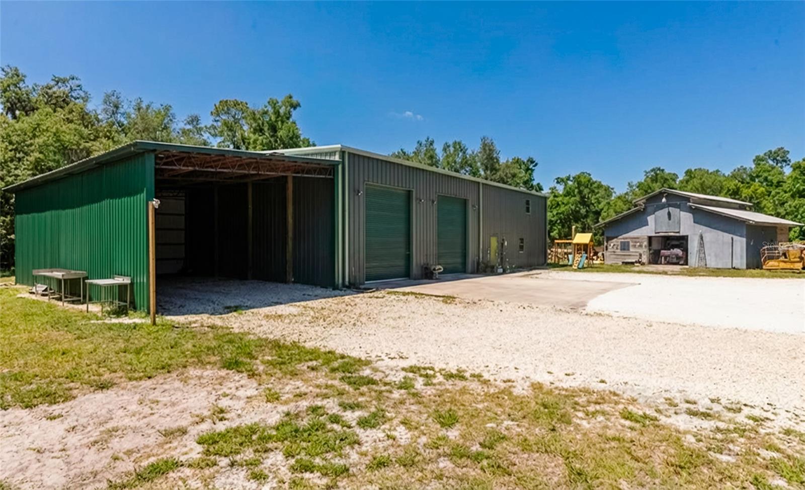 Beautiful over 10 Acres. OuE-1 Zoned Property for Agriculture use. 4000 sq foot workshop with 2/2 spacious apartment. The property may be used for Horses, Cattle, or Agriculture operations. Not in a Flood zone. There is also a 3 stall barn and a home that is a rehab. 
Just minutes to Lakewood ranch and i75.