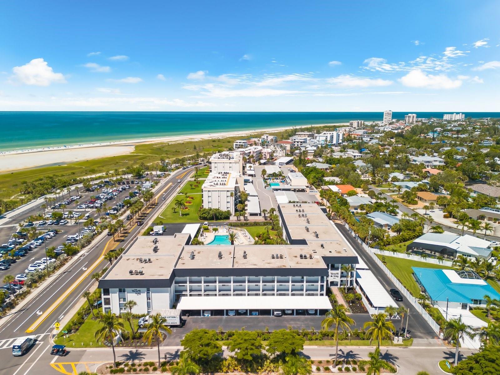 SELLER SAYS BRING ALL OFFERS! MAJOR PRICE IMPROVEMENT!! Reduced over 75k! Have you ever wondered what it's like to own a Siesta Key sunset? Throw on your swimsuit, grab a towel and take a short stroll across the street, because here at Beach Way, you can't get much closer! Embrace your very own next-level Florida lifestyle with this exceptional opportunity. This second floor 2-bedroom, 2-bathroom condo is ideally situated and directly across the street from the world-renowned Siesta Key Beach, continuously celebrated for its powdery soft, white quartz sands and clear waters. This property is being offered fully furnished and is move in ready, presenting a unique chance to personalize your very own dream retreat whether as a permanent residence or a vacation getaway. This unit beams with natural light throughout, showcasing its rare beauty. With a minimum lease period of one month, up to twelve times a year, it also offers potential for rental income. Rental Proforma attached. As you enter the front doors to this beach oasis, prepare to be impressed by an open-concept kitchen that seamlessly flows into the living and dining areas, extending out to a private screened-in lanai where you can take in partial glimpses of the Gulf, creating a perfect setting for relaxation and entertaining. Need a little space? Both bedrooms feature walk-in closets, providing ample storage and comfort. In addition, the unit overlooks the community's heated pool which is maintained at 85 degrees year-round. This well-maintained community was built in 1970, offering a host of amenities designed for convenience and leisure. Residents have access to a community room with a full kitchen for social gatherings, picnic and grilling areas, elevators, laundry facilities on each floor, and a personal storage unit. In addition, your deeded carport is located just steps from your front door, ensuring ease of access. Recent updates to building include a new roof in 2020, an updated elevator installed in 2019, re-plumbed stacks completed in 2018, the addition of new vinyl fencing in 2021. The quarterly condo association fee covers access to all the amenities, pest control, basic cable, water/sewer services, grounds maintenance, weekend on-site maintenance, and community insurance. Living on Siesta Key means more than just proximity to the beach; it's about embracing a lifestyle where every day feels like a vacation. Start your mornings with a peaceful walk along the shoreline, enjoy paddleboarding in the calm Gulf waters, or partake in beach yoga sessions at sunrise and drum circle Sundays. The island's laid-back atmosphere is complemented by its vibrant community, offering a mix of friendly full-time residents and seasonal visitors. Ready to venture out for some more fun? Siesta Key Village, just a short distance away, is the heart of the island's social scene. Here, you'll find an array of casual bars, eateries, and boutiques, perfect for evening outings or weekend brunches. The community's eclectic vibe ensures there's always something happening, from local festivals to live music events. Other close by attractions include the Ringling Bridge, Downtown Sarasota and St. Armands, close proximity to top rated schools and hospitals, SRQ Airport and University Town Center. Don't let another Season pass you by from owning your own slice of paradise in the sand. Schedule your showing today.