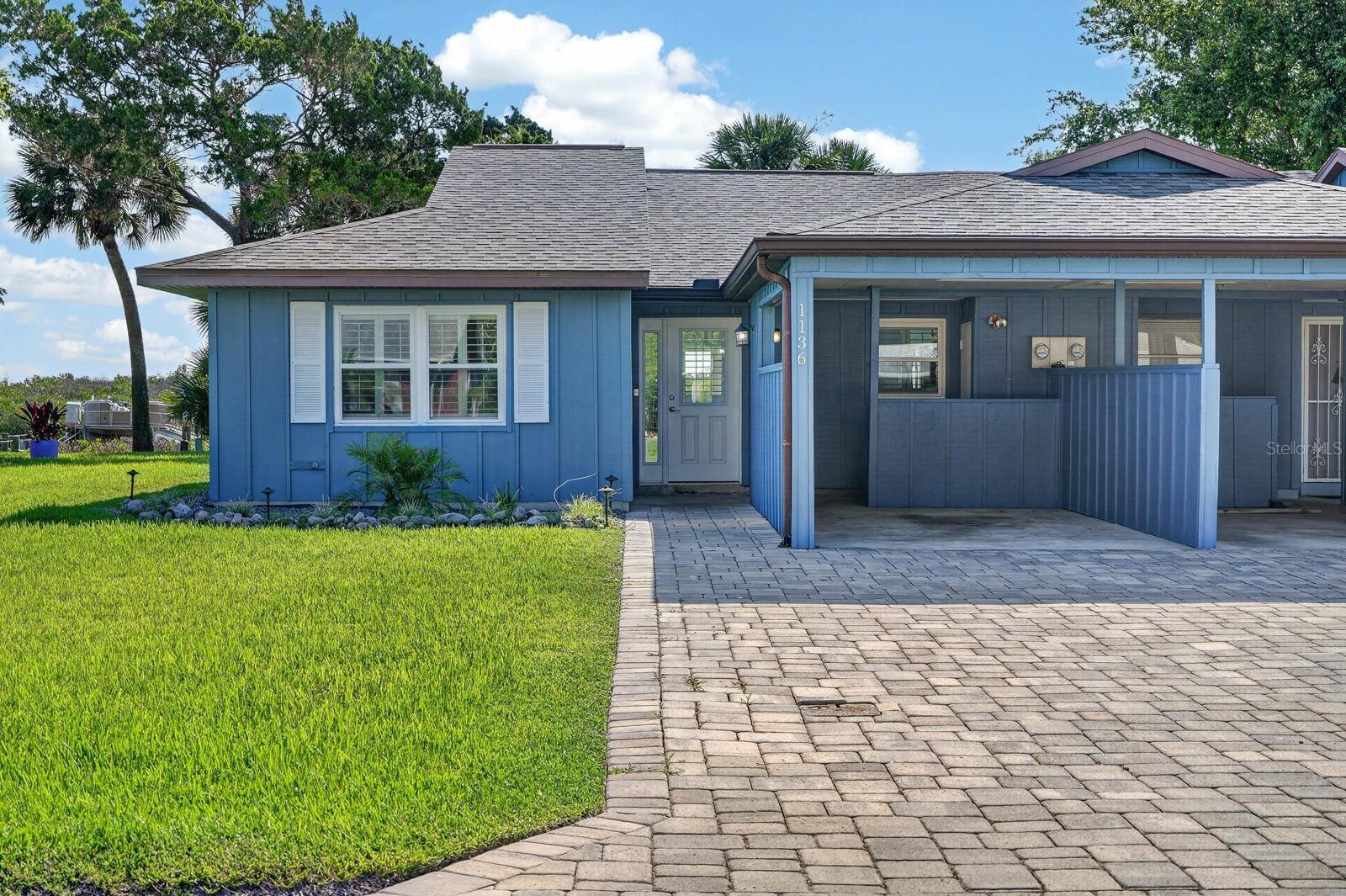 Completely reimagined from top to bottom, this exceptional waterfront residence in Harbour Point delivers the perfect blend of luxury, low-maintenance living, and direct Intracoastal access. Every detail has been thoughtfully renovated, creating a truly move-in-ready coastal retreat for boaters, anglers, and anyone who appreciates life on the water.Extensive exterior improvements include a new roof, new soffits, all-new Hardie® cement board siding, new doors, and new windows. A beautifully finished paver driveway welcomes you home, while an extended rear paver patio leads to a brand-new private dock featuring composite decking, electricity, and water. With deep-water access and no fixed bridges to the Intracoastal Waterway, your next day on the water is only steps from your back door.Inside, oversized porcelain plank tile flows throughout the home, complemented by a stunning designer kitchen featuring a massive center island, stainless steel appliances, and abundant workspace for entertaining. Both bathrooms have been completely renovated with custom tile showers, frameless glass enclosures, and stylish new vanities. Additional upgrades include a high-efficiency hybrid water heater and full-size washer and dryer connections.The Harbour Point lifestyle is as impressive as the home itself. The HOA includes cable, high-speed internet, lawn care, irrigation, a clubhouse, resort-style community pool, community boat ramp and dock, allowing you to spend more time enjoying the waterfront and less time maintaining it. Waterfront homes with deep-water Intracoastal access in Harbour Point rarely become available. Combining a complete renovation, premium waterfront amenities, and an unbeatable boating lifestyle, this home represents an outstanding value in one of Port Orange's most desirable waterfront communities.