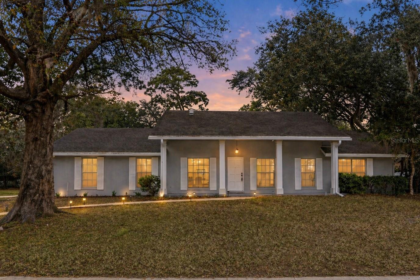 Nestled within the coveted community of Sweetwater Oaks, this exceptional lake-access residence offers the perfect blend of refined luxury, timeless design, and resort-style living. Situated on a beautifully landscaped and fully fenced .32-acre homesite, this meticulously updated 4-bedroom, 2.5-bath pool home with a spacious 2-car garage makes an unforgettable first impression with its striking curb appeal and lush tropical surroundings. Inside, an airy open-concept floorplan is enhanced by wide-plank luxury vinyl flooring, abundant natural light, and thoughtfully curated finishes throughout. Designed with both entertaining and everyday comfort in mind, the chef-inspired kitchen features sleek quartz countertops, stainless steel appliances, generous cabinetry, and picturesque views overlooking the sparkling pool and outdoor living spaces. The spacious primary suite serves as a private sanctuary, complete with a spa-caliber ensuite bath showcasing an oversized designer-tiled walk-in shower with dual shower heads for a true retreat experience. Additional bedrooms are generously sized and filled with natural light, creating warm and inviting spaces for family and guests alike. Expansive sliding glass doors seamlessly connect the indoor living areas to a screened lanai and private backyard oasis. Whether hosting gatherings, relaxing poolside, or enjoying peaceful Florida evenings, the outdoor setting delivers the ultimate backdrop for year-round enjoyment. Residents of Sweetwater Oaks enjoy an unmatched lifestyle centered around private access to Lake Brantley and the exclusive Sweetwater Beach park. Community amenities include boating, skiing, sailing, kayaking, fishing, tennis courts, pickleball courts, sand volleyball, playgrounds, and a vibrant community center hosting events throughout the year. Nearby, Riverbend Park offers additional outdoor recreation with scenic nature trails, sports fields, kayaking and canoe launches, and direct access to the beautiful Wekiva River. Ideally located within the highly sought-after school district for Sabal Point Elementary School, Rock Lake Middle School, and Lake Brantley High School, this remarkable home presents a rare opportunity to experience elevated living in one of Central Florida’s most established and desirable communities.