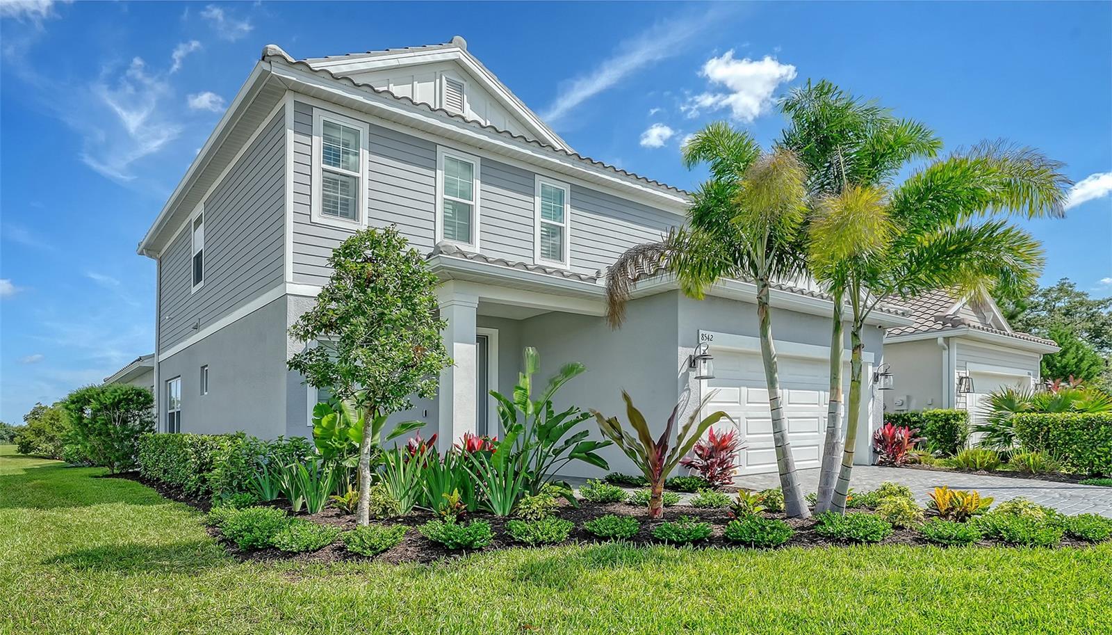 Welcome to 8542 Frangipani Terrace in Windward at Lakewood Ranch, where designer finishes, thoughtful upgrades, and effortless Florida living come together in one of Sarasota’s most desirable gated communities. Built in 2023, this 4-bedroom, 2.5-bath home with downstairs Primary Bedroom offers 2,483 square feet of light-filled living space with tile flooring, an open-concept layout, walk-in closets, and a beautifully upgraded kitchen. The outdoor living area is the showstopper, with a private pool and spa, outdoor kitchen, covered lanai, and sliding doors that create the perfect indoor-outdoor flow. Additional upgrades include water filtration, hurricane-rated windows and sliders, irrigation, natural gas, generator and a tile roof. Located off Fruitville and Lorraine, Windward offers exceptional convenience to UTC, Waterside, downtown Sarasota, and Gulf beaches including Siesta Key, Lido, and Anna Maria Island. Residents enjoy a 9,600 sq. ft. clubhouse, two gyms, playground, tennis and pickleball courts, two dog parks, and two resort-style pools. Don’t wait to build when this upgraded Windward pool home is ready now.