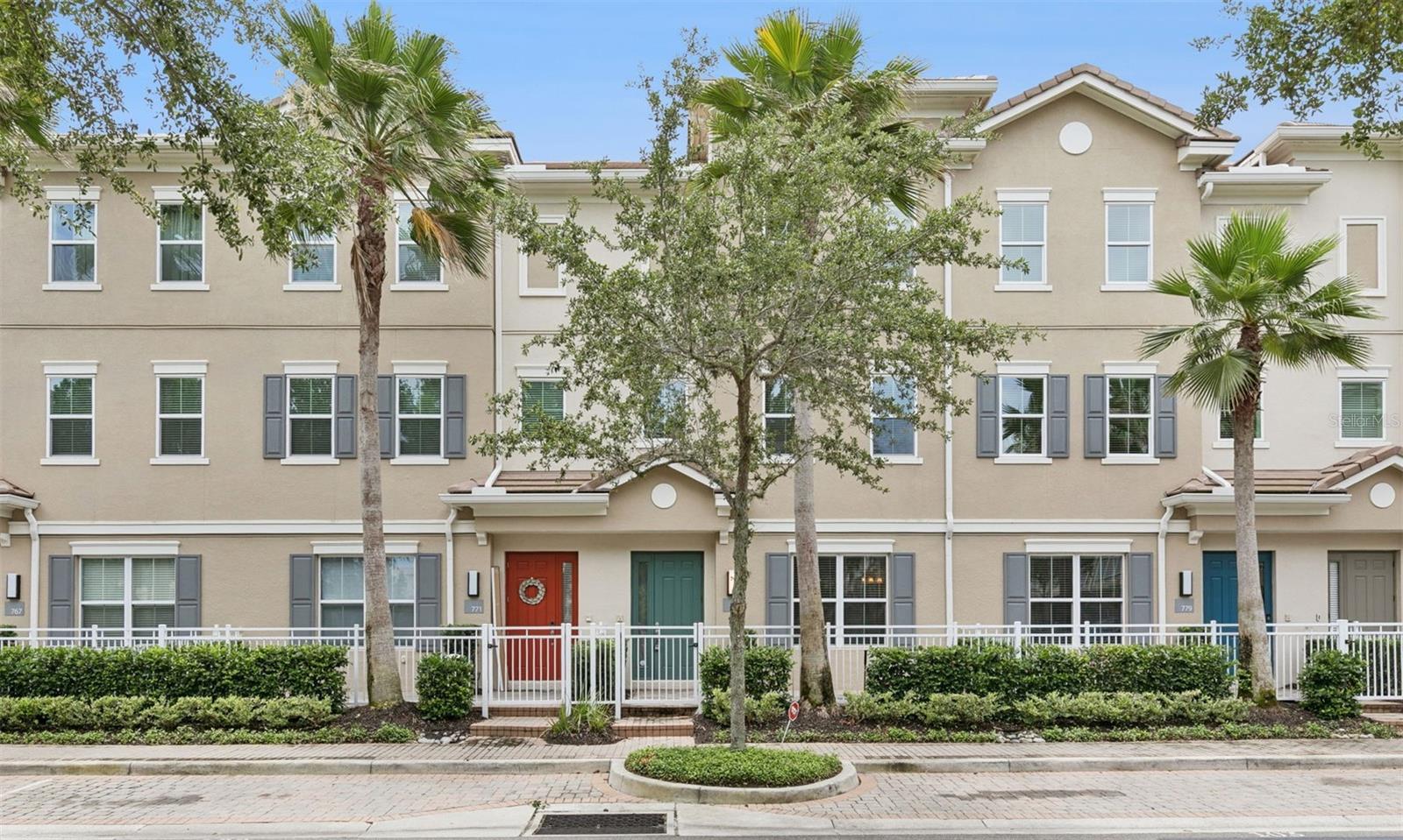 One or more photo(s) has been virtually staged. Relax and enjoy maintenance-free luxury living in this MOVE-IN READY townhome located in the prestigious GATED COMMUNITY OF GRANDE OAKS AT HEATHROW. This HIGHLY SOUGHT-AFTER Evergreen floor plan offers a FRONT-SIDE WATER VIEW, over $20,000 IN UPGRADES, FRESH INTERIOR PAINT, and BRAND-NEW CARPET. A spacious brick-paver front porch welcomes you into this versatile three-story residence featuring a first-floor suite with elegant FRENCH DOORS and a full bathroom, making it ideal as a bedroom, home office, or flex space, along with access to the oversized 2-CAR GARAGE. The second floor showcases a bright and open living space with a gourmet kitchen featuring STAINLESS STEEL APPLIANCES, 42-INCH CABINETS, GRANITE COUNTERTOPS, abundant storage, and TILE FLOORING, all overlooking the dining area and expansive great room. Just off the kitchen, step outside to your PRIVATE COVERED BALCONY, perfect for morning coffee or evening relaxation. The third floor offers two generous ensuite bedrooms, including the owner's retreat featuring a tray ceiling, large walk-in closet, and luxurious bath with dual vanities, makeup station, and glass-enclosed shower. Laundry is conveniently located on the third floor. Enjoy the benefits of extensive recent community improvements, including but not limited to NEW ENERGY-EFFICIENT WINDOWS, NEW ROOFS, NEW BALCONIES, NEW STUCCO, AND FRESH EXTERIOR PAINT, significantly enhancing both the appearance and long-term value of the community. The HOA includes Spectrum cable, Smart City high-speed fiber internet, alarm monitoring with intercom doorbell system, exterior maintenance, and access to all community amenities. Enjoy RESORT-STYLE AMENITIES including a clubhouse, fitness center, swimming pool, spa, playground, and pedestrian bridge over the scenic pond. Ideally located within walking distance to COLONIAL TOWNPARK with shopping, dining, entertainment, Publix, and a movie theater, while offering convenient access to I-4, SR-417, THE SEMINOLE TRAIL, and top-rated SEMINOLE COUNTY SCHOOLS. This exceptional townhome combines luxury, convenience, and low-maintenance living in one of Heathrow's most desirable communities. Schedule your private showing today!