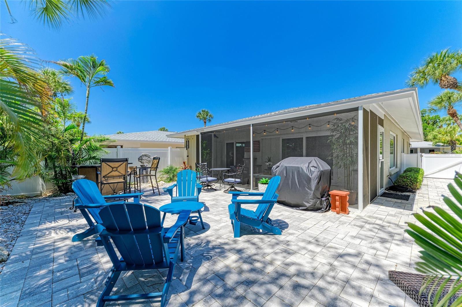 Welcome to your New Home, minutes from the world-renowned Siesta Key Beach, consistently ranked as one of the #1 beaches in the U.S famous for its powdery white quartz sand and crystal-clear Gulf waters.  This impeccably remodeled turnkey furnished home offers an exceptional opportunity to enjoy the best of coastal living within the charming Polynesian Gardens community.
This, home offers a refined take on island living, featuring a new roof, new AC, and impact-rated windows and doors for style, comfort, and peace of mind. Designed with a light, coastal aesthetic, the open-concept layout is both inviting and functional.
At the heart of the home, the designer kitchen showcases custom white cabinetry, brand-new stainless appliances, and a tile backsplash, complemented by a dining area seamlessly positioned adjacent to the kitchen and perfect for effortless entertaining or relaxed everyday living.
The home features a spacious primary suite with a beautifully appointed ensuite bath, along with a guest bedroom and full guest bathroom, offering privacy and comfort for family and visitors.
The living space extends into an enclosed, expanded lanai, creating a versatile indoor-outdoor retreat to enjoy year-round.
A rare highlight is the oversized private garden, offering a lush, tropical setting with exceptional privacy, an uncommon feature that truly sets this villa apart and enhances the feeling of a private coastal escape.
Residents of Polynesian Gardens enjoy a resort-style lifestyle with amenities including a community pier on the intercoastal, a heated pool, and clubhouse.
Beyond the community, enjoy effortless access to the vibrant energy of Siesta Key Village, known for its beachside restaurants, bars, live music, and boutique shopping, as well as the relaxed charm of Crescent Beach village.
This property also offers a proven rental history with strong year-round bookings, making it an exceptional opportunity for both personal enjoyment and income potential. 
Whether you’re spending the day boating along the Intracoastal, enjoying the white quartz sands of Siesta Key Beach, or unwinding in your own private garden retreat, this exceptional villa captures the essence of luxury coastal living.
Perfectly positioned near Siesta Key Village and the Gulf beaches, this turnkey remodeled property presents an incredible opportunity as a primary residence, vacation getaway, or income-producing investment