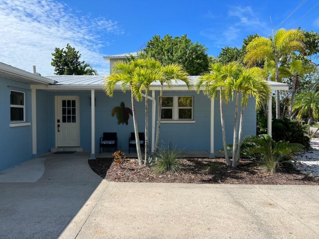 Updated Anna Maria Island 3 bedroom 3 Bathroom pool home only 2 blocks from the beach with a metal roof, concrete block construction, and a garage. Located in a weekly rental zone, this property rents well with all 5-star reviews. The home has an open concept with the kitchen, dining area and living room. There are new kitchen appliances. The primary suite has a sitting area and an en-suite bathroom. The second bedroom has an en-suite bathroom. There is a large, screened porch with both lounging and dining areas. The pool has a heater and chiller.  The furniture has been updated and is ready for you to come in and enjoy. The home is being sold turnkey furnished.