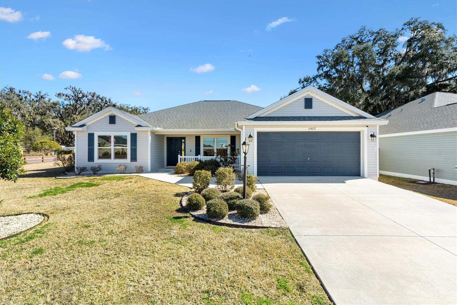 Welcome Home! This stunning 3-bedroom, 2-bath residence in the highly desirable Oxford Oaks community is truly move-in ready. Perfectly blending comfort, style, and convenience, this home is nestled in a quiet neighborhood with exceptional amenities including a resort-style pool, cabanas, pickleball and basketball courts, and a scenic multi-modal sidewalk trail. Ideally located in Oxford, just minutes from The Villages, shopping, schools, dining, and endless entertainment, everything you need is right at your fingertips. Inside, enjoy 1,758 sq ft of bright, open living space designed for both everyday comfort and entertaining. The open floor plan features an inside laundry room (washer and dryer included), a 2-car garage, and a tranquil screened lanai perfect for relaxing. The gourmet kitchen is a standout with shaker-style cabinetry, stainless steel appliances, stylish countertops, and a large island overlooking the living and dining areas. Recessed lighting throughout adds warmth and a modern touch. The spacious owner’s suite is a private retreat, complete with a walk-in closet and a spa-inspired bath featuring dual vanities, a walk-in tiled shower, and a private lavatory. Two additional bedrooms offer ample closet space, while the guest bath features a convenient dual-access layout. Step outside to a private backyard with no rear neighbors, offering peaceful views and plenty of green space. Packed with upgrades and lifestyle perks, this home is an exceptional opportunity in a sought-after community. Schedule your private showing today—this one won’t last!