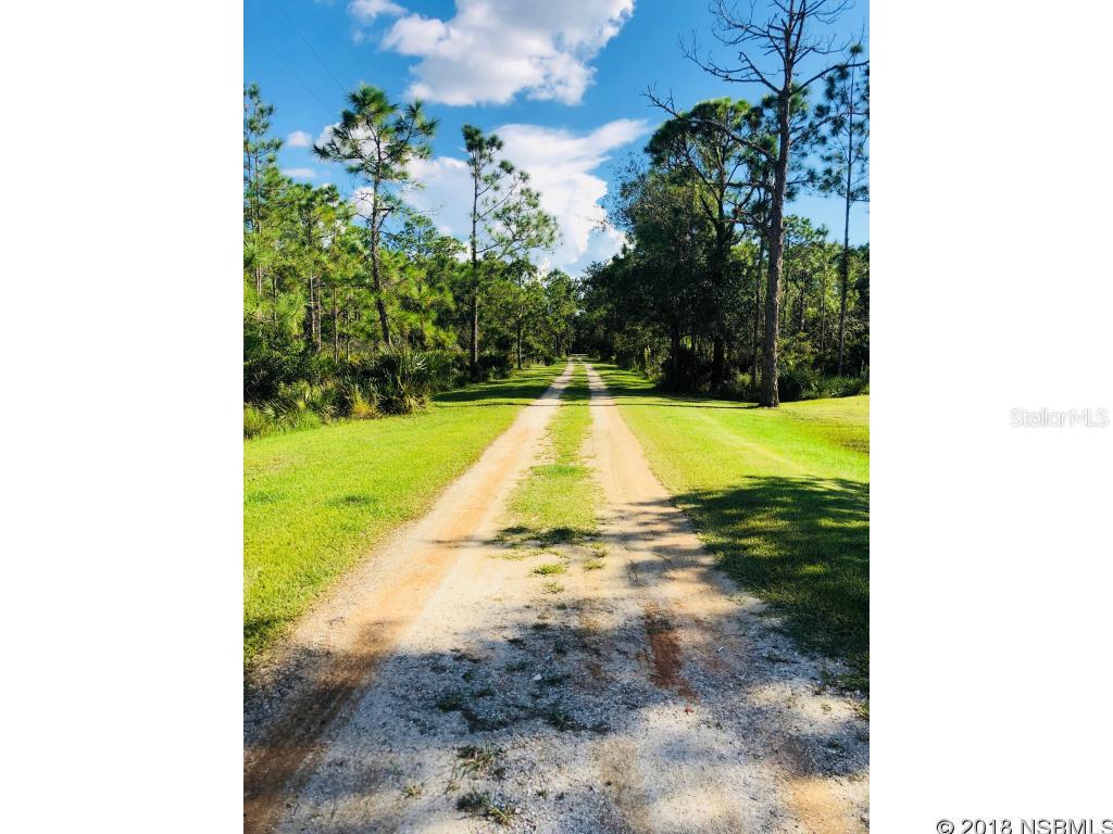 TAKE ME HOME .. ON A BEAUTIFUL COUNTRY ROAD ... THIS CHARMING 2 BEDROOM  2 BATH, WAS CUSTOM BUILT BY OGG BROTHERS IN 2005.A COUNTRY COTTAGE WITH FRONT PORCH AND METAL ROOF WILL AMAZE YOU WITH ITS WELL BUILT OPEN FLOOR PLAN AND OVERSIZED LOT. A NEW AC WAS INSTALLED IN 2014. CUSTOM CABINETRY AND ISLAND IN THE KITCHEN OVERLOOKS FAMILY ROOM AND DINING ROOM. ALL ROOM DIMENSIONS ARE APPROX. AND SHOULD BE VERIFIED.