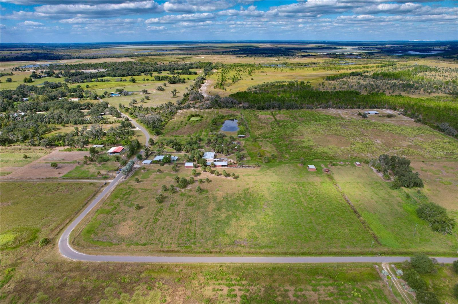 Create your own rural retreat just minutes from downtown Parrish’s expanding shops, schools, and new master-planned communities. This 5-acre parcel sits along paved Bunker Hill Road. The level terrain and quiet setting provide endless potential for a mini-farm, custom estate, or family compound with the two other adjacent 5 acre parcels also available. This property is fenced and nearly 900ft of road frontage. Just one mile from Bunker Hill Community Park, a scenic 490-acre recreational preserve offering open space, trails, and nature views. Buy land, they're not making it anymore!