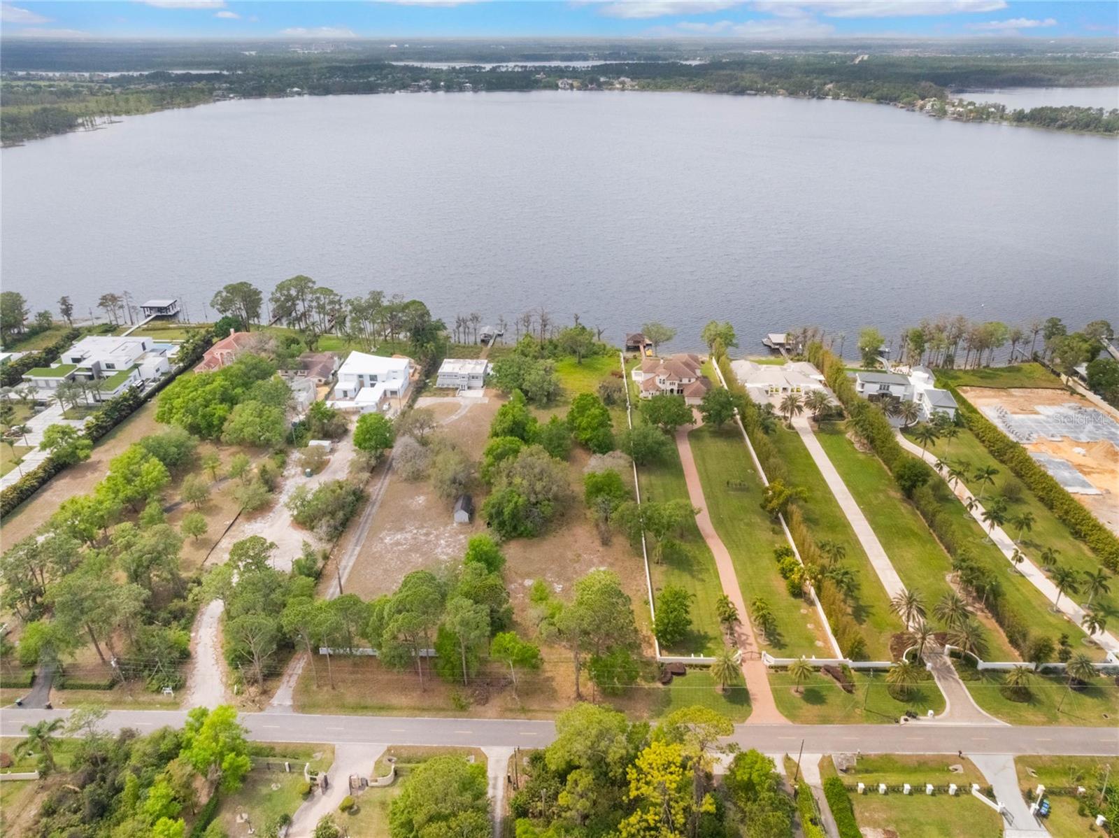 Build your dream home on this expansive 5.86-acre homesite with 129 feet of western-facing shoreline on Lake Sheen, one of the widest lots on Kilgore Road, part of the renowned Butler Chain of Lakes. This listing has two lots, one in the front and one in the back. With over 5,000 acres of pristine waterways, enjoy boating, paddleboarding or kayaking right from your backyard. Evenings will be unforgettable with breathtaking sunset views and Disney's fireworks illuminating the sky. This lot is one of the last remaining opportunities to craft a custom lakefront estate on this iconic street, Millionaire Row, free from HOA restrictions and dues. Choose your builder to bring your vision to life. Prime Southwest Orlando location, on a quiet road with easy access to award-winning restaurants, shopping, major highways and world-class theme parks just minutes away. Lakefront real estate is a rare and timeless investment, don't miss this opportunity to own a piece of Millionaires Row!
<div style="padding:56.25% 0 0 0;position:relative;"><iframe src="https://player.vimeo.com/video/1071611440?badge=0&amp;autopause=0&amp;player_id=0&amp;app_id=58479" frameborder="0" allow="autoplay; fullscreen; picture-in-picture; clipboard-write; encrypted-media" style="position:absolute;top:0;left:0;width:100%;height:100%;" title="9156 Kilgore Road, Orlando, FL 32836 (MLS)"></iframe></div><script src="https://player.vimeo.com/api/player.js"></script>