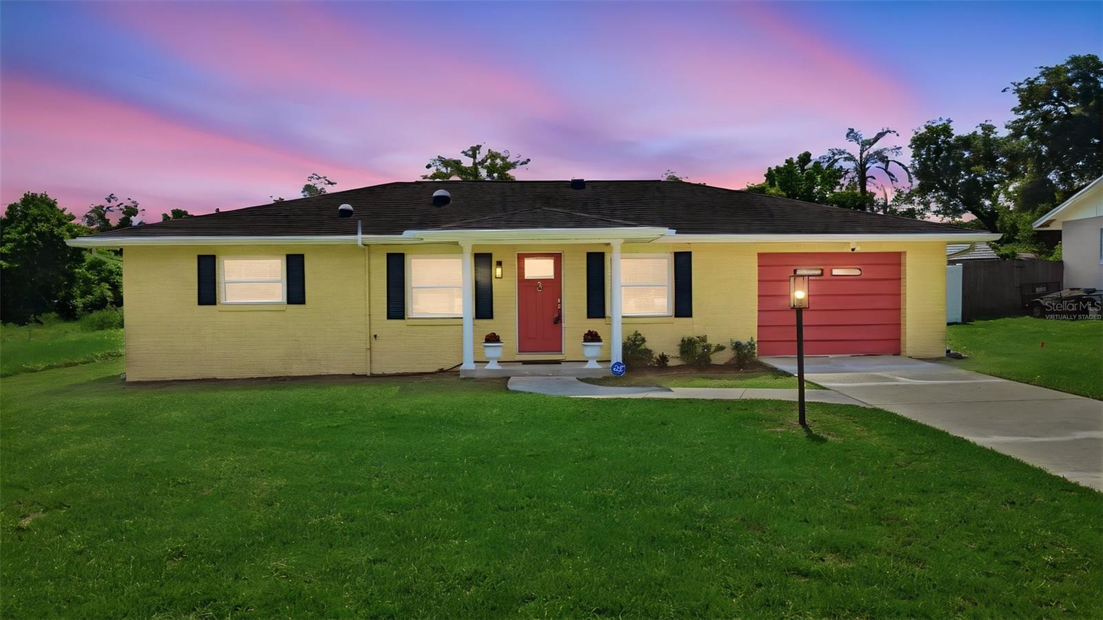 Welcome to this freshly updated 2-bedroom, 1.5-bath home with 1,240 square feet of comfortable living space, an open layout, and a large fully fenced backyard. The living, dining, and kitchen areas flow together easily, with tile flooring throughout the main living spaces, several solar tubes providing an abundance of natural light, and new carpet installed in both bedrooms in 2025. The updated kitchen features brand-new in 2025 stainless steel appliances, a smart range, an abundance of cabinet space, and generous counter space. The bathroom, updated in December 2025, features a gorgeous walk-in shower with a private entrance from the 14’ X 12’ primary bedroom and a separate entrance for guests. Bedroom two includes a private half bath. Enjoy the screened porch and exterior covered sitting area overlooking the huge vinyl fenced (new in 2024) backyard, with plenty of space for Rover to run, outdoor activities, gardening, and entertaining. Additional features include newer double hung windows installed in 2021, a new water heater in 2026, an indoor laundry room (washer and dryer DO stay), and an oversized one-car garage for added storage and convenience. Thoughtful updates and generous indoor and outdoor spaces make this DeLand home easy to enjoy. 24/7 video and audio surveillance on premises.Please ask your Realtor® for the unbranded virtual walking tour of this home.From 15A/Spring Garden head east on Euclid and turn left onto S Brooks. Home will be on your right. All measurements are approximate and should be independently verified.
