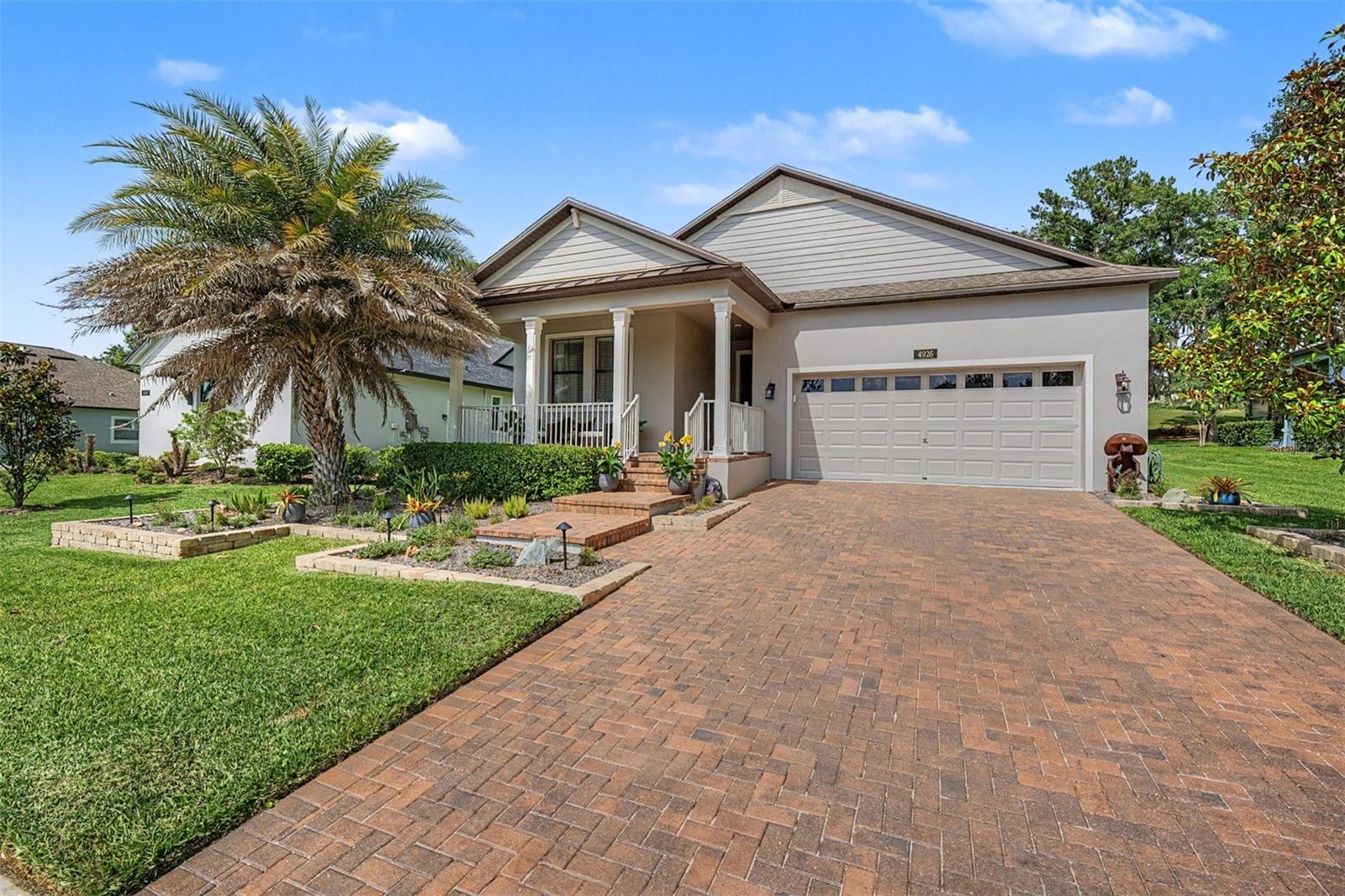 Welcome to your DREAM home in the prestigious Southern Hills Golf Course Community — and not just any home... a former model home, upgraded with over $90,000 in additional features, that showcases everything this STUNNING neighborhood has to offer! Light, bright and pristine, this move-in ready, beautifully appointed Sunburst floorplan offers 1,959 square feet of thoughtfully designed living space with two bedrooms, two baths, plus a versatile flex room that can easily serve as a third bedroom or private home office — the choice is yours! Flex room has been upgraded with a built-in desk cabinetry, file drawers on both sides and a Murphy bed with matching nightstands, making it as functional as it is stylish. From the moment you enter, the casual elegance abounds! Foyer boasts a framed accent wall with wide hallway past the flex room to the  OPEN kitchen which will stop you in your tracks!  42" staggered Scottsdale Maple Espresso raised square panel cabinets crowned with elegant molding and satin nickel hardware frames are complimented by the gleaming granite countertops and sleek stainless-steel GE appliances — all grounded by 18x18 Cabo Coast ceramic tile laid on the diagonal for that perfect finishing touch! Warm engineered wood floors usher you into the OPEN great room complete with accent entertainment wall. The primary suite is a true retreat, featuring a custom walk-in closet with a center island of drawers for generous storage. The oversized laundry room comes equipped with an extra refrigerator, and the oversized two-car garage impresses with a newly epoxy flocked painted floor, built-in storage cabinets, and a workbench — ideal for hobbyists and organizers alike.  Entertaining here is effortless. A huge wrap-around covered porch invites guests to linger and unwind, while the large rear lanai extends your living space into the warm Florida outdoors. And the backdrop? A breathtaking wooded golf course lot along the 15th fairway, framed by a see-through wrought iron fence that lets those gorgeous views take center stage. Brick paver and stone landscaping beds with landscape lighting complete the picture-perfect exterior, front and back!  Beyond your doorstep, Southern Hills Community delivers the best of both worlds — the luxury of a country club lifestyle wrapped in the warmth of small-town charm. Rolling hills and majestic live oak trees set the scene for this gated community, centered around the renowned Pete Dye Championship Golf Course. The stunning Antebellum clubhouse features a full-service restaurant, a resort-style swimming pool, and an enclosed poolside bar and restaurant — everything you need to live well and socialize beautifully. And when you're ready to venture out, downtown Brooksville's quaint shops, restaurants, and community events are just minutes away. Located North of Tampa with easy access to major highways for easy commute to Ocala,Tampa, Orlando, International airports and the famous beaches! This is more than a home — it's a lifestyle. Come see it for yourself.  CALL TODAY!