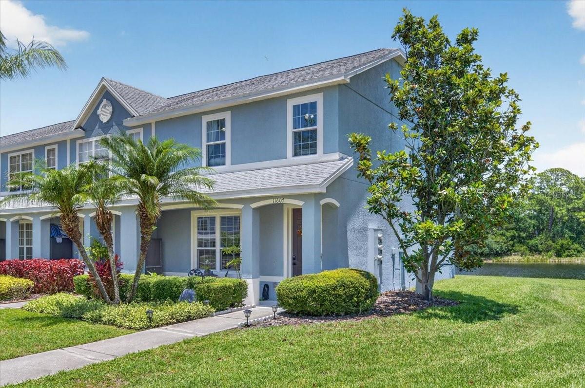 Under contract-accepting backup offers. Enjoy the best of Florida living in this beautifully maintained 3-bedroom, 2.5-bath end-unit townhome in Bay Port Colony. Offering one of the community's larger floor plans, this home combines thoughtful updates, peaceful pond and conservation views, and an exceptionally convenient location. Elevated ceilings and abundant natural light create an inviting atmosphere from the moment you enter, while the rear of the home overlooks tranquil water and conservation areas, providing a relaxing backdrop for everyday living. Just steps away, the community pool offers the perfect place to unwind, cool off, or enjoy Florida's year-round sunshine without the maintenance of owning a private pool. Inside, you'll find new laminate flooring (Oct. 2025), fresh interior paint (2026) including all ceilings, trim and doors, and a functional layout designed for comfortable living. Major exterior improvements include a new roof (2022) and exterior paint and stucco (2024). One of the home's standout features is more than $30,000 in hurricane-impact windows and custom hurricane-impact sliding glass door, providing enhanced storm protection, energy efficiency, reduced insurance premiums and noise reduction.  Location is where this home truly shines. The Upper Tampa Bay Trail is just a short walk away, offering miles of scenic paths for walking, running, and biking. Everyday conveniences are practically at your doorstep, with Target, Michaels, grocery stores, restaurants, and other popular shopping destinations just minutes away. Despite being close to everything, the pond and conservation views create a peaceful retreat to come home to each day. The low HOA, well-maintained community, and prime Tampa Bay location make everyday living easy. Zoned for highly rated schools and situated approximately 15 minutes from Tampa International Airport, 20 minutes from downtown Tampa, and within easy reach of Tampa Bay's business centers, entertainment venues, and Gulf Coast beaches. Whether you're enjoying the serene views, taking a stroll on the trail, relaxing by the pool, or taking advantage of the unmatched convenience of the location, this exceptional townhome offers a lifestyle that's as appealing as the home itself.