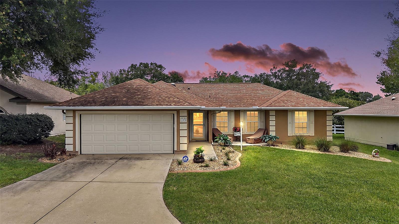 Enjoy the best of an active resort living in Stonecrest, a gated 55+ community featuring a champion golf course and outstanding amenities. 
With endless activity and social opportunities, you'll feel like you are on vacation year round. We are so close to The Villages!!
This beautiful maintained 3-bedroom, 2-bath, a desirable, soaring ceiling through out. The bright eat-in kitchen, bay window, pantry, cabinets, granite countertop with coordinating back splash, ample cabinetry , and a convenient  and a pass through window, great for entertaining guest.
Formal dining room showcases elegant wall paneling and the wall and French doors.
Living room with fantastic laminated floors through out the house, windows the bring in the natural light into this home. 
Spacious Primary Suite includes a walk-In closet, fan and blinds.  En-suite with large walk in shower, separate vanity area, and a private water closet. 
Two comfortable guest  bedrooms are conveniently separated by a well-appointed guest bath for privacy and family visitors. 
 Additional features inside Laundry room with washer, dryer, and ample storage space.  Lanai is off the dining room, passed the French Doors. The lanai has tile floors, fan, sliding plexiglass locking windows. Gorgeous hedge off the lanai for privacy. A door way opens to the patio were grilling your favorite foods and relaxing can be fun. 2 Car Garage with  Epoxy striking easy to maintain floors and a  Utility sink, garage has so much storage and an electric garage screen door is included...
Front door has a storm door, Roof  2021, A/C 2016, 2 Skylight, 

HOA FEE $152.00 and month includes: 4 Pools (1-indoor ), Jacuzzi, Pickleball Courts, Baseball field, Pond for catch and release fishing, Dog park, Shuffle Board, 50 Clubs, Fitness Center, Club House and so much more!
Close to The Villages, Restaurants, Doctors Offices, Hospital, Publix, Hair and Nail Salons, The V.A. There is RV Parking which is not included in the HOA FEE.   PROFFESSIONAL PHOTOS TO ARRIVE JUNE 15,  Thank You