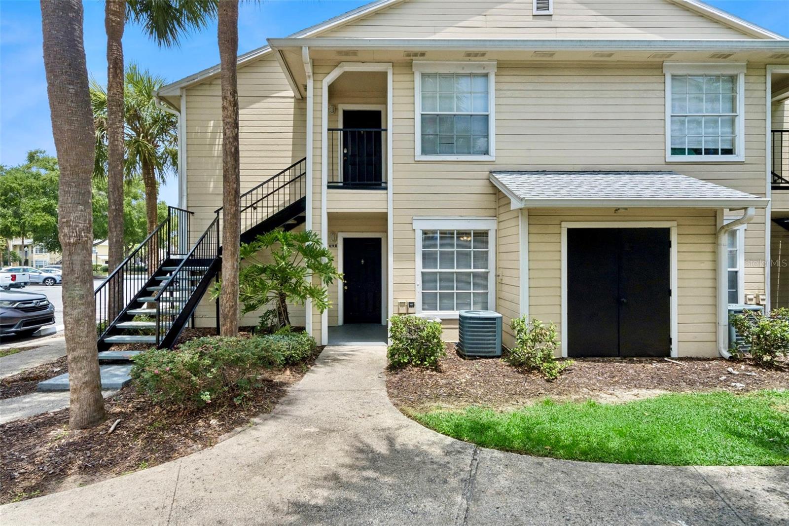 Welcome to this beautifully updated 2 bedroom 2 bath, first floor condo at Tradewinds of Metrowest! As soon as you walk in you will be struck by the open floor plan and wall of windows letting in tons of natural light. The condo features a central combined living room, dining and kitchen area, with a split bedroom layout, having a bedroom on either side of the unit. There is newer LVP flooring installed throughout and the interior has been freshly painted! The kitchen has a laundry closet attached with washer and dryer included as well as shelving for additional storage. Through to the primary suite you will note a walk-in closet and private ensuite bathroom. The guest bathroom is located just outside in the hallway adjacent to the guest bedroom for convenient access to both the living room and guest bedroom areas. Through the sliding doors off the dining area there is a private patio and extra storage closet as well!  The unit is at the front of the community with easy access to the community clubhouse with fitness center and large pool! The Tradewinds community features multiple pools, tennis court, waterside cabana and grilling area, clubhouse and fitness center. All this in an ideal location close to shopping, theme parks, MetroWest Golf Club and so much more! Schedule a viewing today!