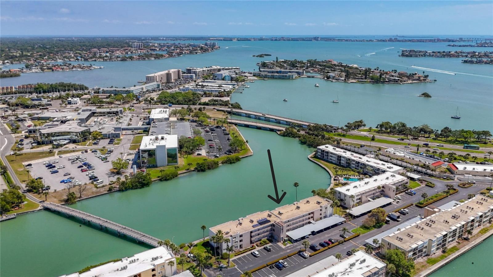 Make sure this Bright and Spacious 2 bed/2 bath condo is on your List! Bright - Light with a peaceful eastern view, enjoy your morning coffee with the sunrise, while your dolphin neighbors are passing by; all situated on a quiet Pass connecting Boca Ciega Bay to the Intracoastal. Minimal water intrusion from past storms resulted in a fresh updated condo, new Frigidaire appliances, new filtered water system at the sink, lovely light patterned quartz countertops in kitchen and both baths, new carpeting through Great room and both bedrooms and gorgeous 3 panel hurricane rated Sliders to enhance the wonderful view. The primary bedroom is airy and light, large walk-in closet and ensuite bath with walk-in shower, creates a peaceful retreat. Stack Laundry hookup near guest bath. Your covered parking is directly in front. The Bay Island Community has So much available for the +55 resident! your small pets ( 2 cats or 1 small dog + 1 cat ). Very active Rec / Social Center, large party rooms and kitchen on 2nd floor, His & Her gyms, billiards, card room, multiple tennis and pickleball courts, hot tub and 7 inground pools, and a Marina plus 1.4 miles of seawall walkway that surrounds the community. Bay Islands is a secure, gated community located in S Pasadena, between St Pete Beach and St Petersburg and next door to Gulfport - with SunRunner Express Bus access to St Pete Beach and into downtown St Pete ( Let's go to a Rays game! ) right out front, famous St Pete Beach, shopping, dining, golf and all sorts of entertainment are minutes away. There is a $3,000 credit available for the new owner to design the primary closet, chose the perfect window treatment for the Sliding doors or offset the monthly fees. Put this cute - fresh condo at the top of your List !