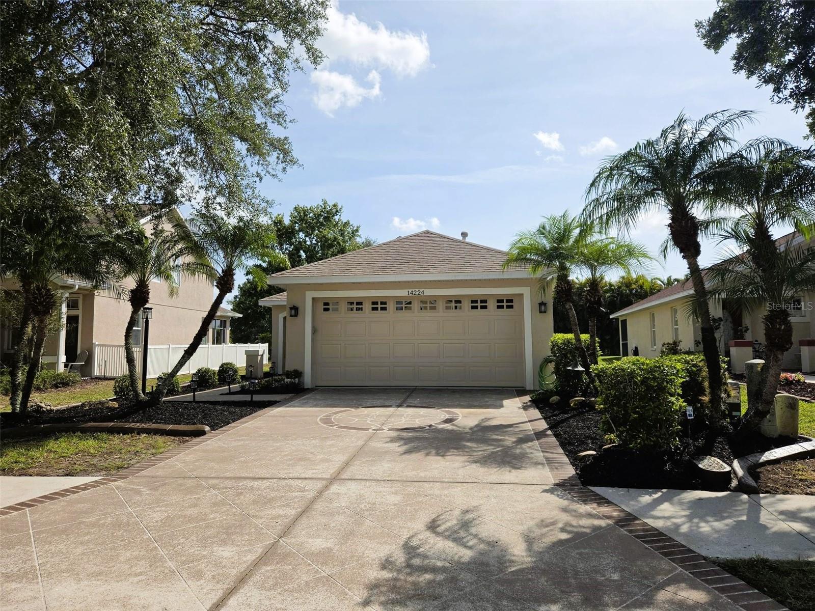 WELCOME TO GREENBROOK VILLAGE IN LAKEWOOD RANCH
Pride of ownership shines throughout this impeccably maintained 3-bedroom, 2-bath home with a 2-car garage, offering 1,275 square feet of comfortable living space on a quiet cul-de-sac street.
The open-concept floor plan creates a bright and inviting atmosphere, with sightlines extending from the front entry through the great room to the screened lanai and picturesque lake beyond. The well-appointed kitchen features stainless steel appliances, a large designer-style sink, breakfast bar seating for four, and a cozy eat-in dining area.
The spacious primary suite offers a private retreat with an en-suite bath featuring a garden tub, separate shower, and large walk-in closet. Two additional bedrooms provide flexibility for guests, a home office, or hobbies.
Step outside to the covered and screened lanai where you'll enjoy peaceful lake views, breathtaking Florida sunsets, and a private backyard with plenty of room for a future pool.
Recent Updates Include:
• New Roof (2023)
• Exterior Painted (2025)
• New Laminate Flooring Throughout Main Living Areas
• New Carpet in Bedrooms
• New Lighting Fixtures
• New Blinds Throughout the Home
• Generator Hookup/Electrical Connection Installed
• Whole-House and AC Surge Protection
Greenbrook Village offers an exceptional lifestyle with parks, playgrounds, sports fields, scenic walking and biking trails, and one of the area's most popular dog parks. Families will appreciate the highly rated schools, including an elementary school conveniently located just around the corner.
Enjoy easy access to Lakewood Ranch Main Street featuring shopping, dining, and a movie theater, while I-75 is only minutes away for convenient commuting. This move-in-ready home is available now—just in time to settle in before the new school year begins.