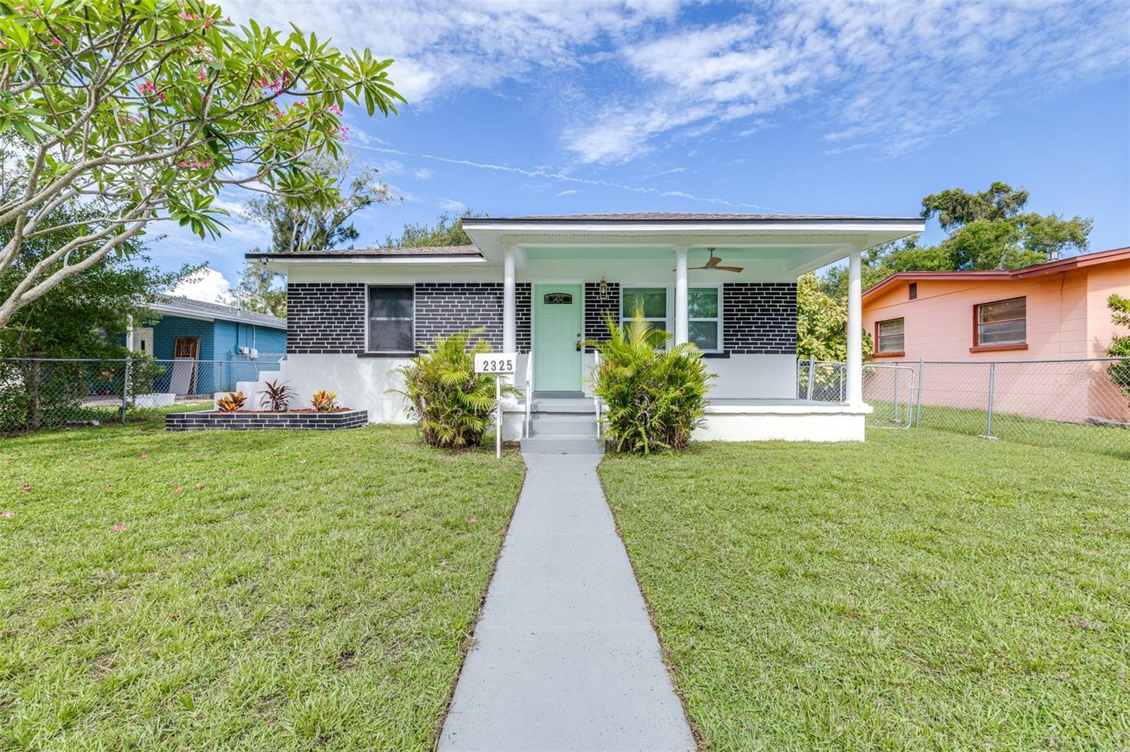 Virtually Staged. One or more photos has been virtually staged. Welcome to this beautifully renovated, move-in ready 3-bedroom, 2-bathroom block home in the heart of South St. Petersburg. Combining modern upgrades, flexible living spaces, and an unbeatable location, this turnkey property is ready for you to call home. Step onto the inviting front porch and into a bright, open interior filled with natural light. The stylish kitchen features granite countertops, solid wood cabinetry, and stainless steel GE appliances, creating a space that is both functional and elegant. Just beyond the kitchen, a versatile flex room offers endless possibilities as a home office, nursery, fitness space, or retreat and leads to the private primary suite with its own beautifully updated bathroom. Two additional bedrooms and a second full bath provide comfort and privacy for family and guests. Outside, the fully fenced yard offers plenty of room for entertaining, pets, or future outdoor enhancements, while the stone driveway with alley access adds convenience. Major updates include a new HVAC system and ductwork, updated electrical and plumbing, tankless water heater, new windows, flooring, interior and exterior paint, and modern fixtures throughout. Ideally located just minutes from downtown St. Petersburg, Gulf beaches, shopping, dining, and major highways, this home offers the perfect blend of comfort, convenience, and Florida living.