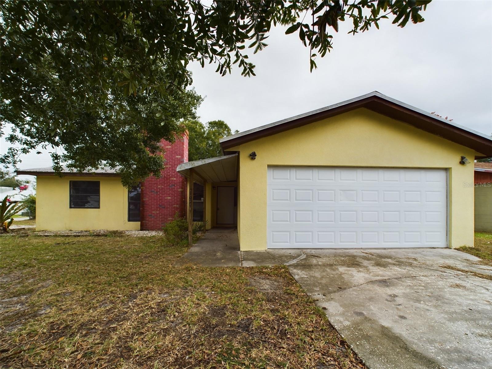 MUST SEE! NO HOA! Welcome to this charming 3 bed, 2 bath home in Winter Haven! This single family home has a brick fireplace located in the living room, large windows and a cozy atmosphere due to being a house built in the 80s. Just under quarter acre of land. Freshly painted, durable metal roof, and with tile flooring all throughout. Walk-in shower in master bathroom. Enjoy some fresh air, peace and quiet with the protection of a backyard screened lanai. Oversized corner lot, with your very own private mailbox in front yard. Supermarkets, shopping, restaurants, lakes all within a short 5 min drive. Seller financing available. Do not wait, it will not last long!