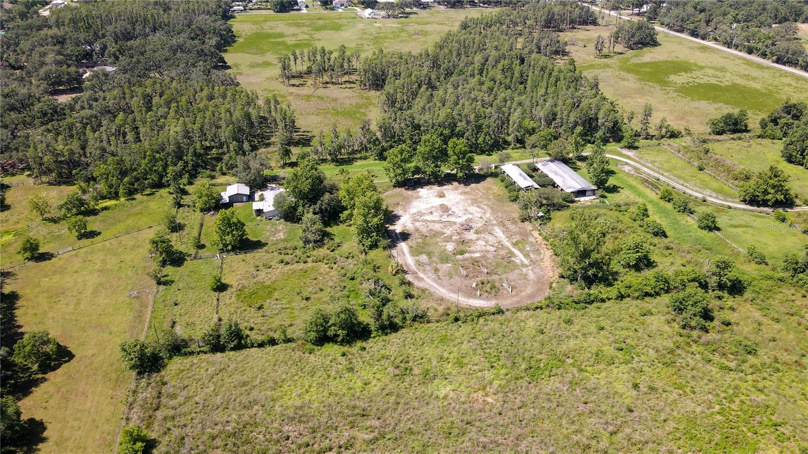 Perfectly positioned in the thriving Plant City area, this property presents a compelling land investment opportunity comprising just over 9 acres. The expansive site is zoned AS-1, allowing for a variety of potential uses subject to the appropriate approvals. Its central Plant City location offers convenient access to established commercial areas, major roadways, and regional transportation corridors. This offering is well-suited for investors or end users seeking a strategically located parcel with long-term redevelopment or repositioning potential in a growing market.

Infrastructure on site includes a home, two horse barns, and a detached garage. The property is being sold as-is. 

Located in the vibrant city of Plant City, FL, the area surrounding the property is known for its thriving business community and abundant amenities. Just a short distance from the property, investors will find popular attractions such as the historic Plant City Downtown, featuring charming shops and local dining. For those seeking natural tranquility, the nearby Edward Medard Park offers pristine lakes and scenic trails. Additionally, the property is conveniently situated near major roadways and transportation hubs, making it an ideal location for an office or office building investment. With its blend of commercial opportunities and local charm, Plant City presents an exciting prospect for real estate investors.