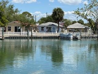 The property is approximately 9,587 square feet of deep hurricane sheltered waterfront.  The lot currently has three small cottages across two lots that must remain in place to secure the grandfathered non-conforming footprint.  Once a site development plan has been approved the cottages can be torn down.  Depending on the purchaser, either the footprint can be maintained with three single family homes built or the two lots can support two single family homes that most likely would require variances with set backs due to buildable lot size.  Ideally the purchaser will build three FEMA, County and City approved structures, three stories each with parking on the first floor and two floors of living space.  The current footprints of each structure is roughly 16 feet wide by 45 feet long.