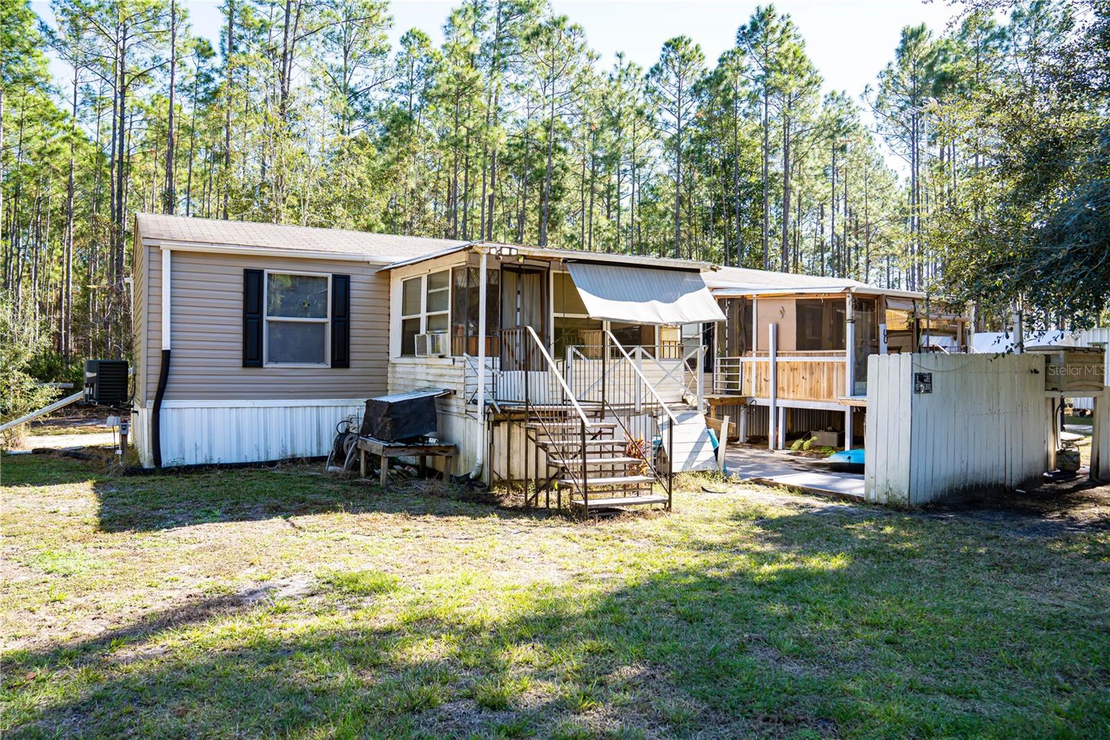 Charming 3-Bedroom, 2-Bathroom Fully Furnished Mobile Home on 1.4 Acres with Potential for 1.16 Acre Lot Expansion!

Welcome to this well-maintained, fully furnished 2019-built mobile home nestled on 1.4 peaceful acres in a serene rural setting. This spacious 3-bedroom, 2-bathroom home offers a cozy yet functional layout with all the modern comforts you need. The home features a dedicated laundry area for convenience and two covered front porches where you can enjoy the quiet surroundings or entertain guests. 

Key Features:

3 Bedrooms & 2 Bathrooms: Ideal for families or those looking for extra space.

Fully Furnished: Move-in ready with furnishings included.

Laundry Area: Equipped for easy chores and organization.

No Dishwasher: Kitchen does not include a dishwasher.

Two Covered Front Porches: Perfect for relaxing with a morning coffee or hosting small gatherings.

Two Sheds: Excellent storage space for tools, equipment, or hobbies.

Storm Shelter: Added peace of mind with a safe space in case of severe weather.

Rain Drains: Thoughtfully designed to manage water flow and keep the property dry.

The property spans 1.4 acres with room for your outdoor projects or relaxation. Additionally, there is an option to purchase the adjacent 1.1-acre partially cleared lot, offering even more space to build, garden, or expand your property.

The property has a utility easement along the front edge, which is maintained and cleared.

Whether you’re looking for a peaceful retreat, a homestead with room to grow, or a place to enjoy the quiet beauty of rural living, this fully furnished mobile home offers the ideal setting. Don’t miss the chance to make this charming property your own!