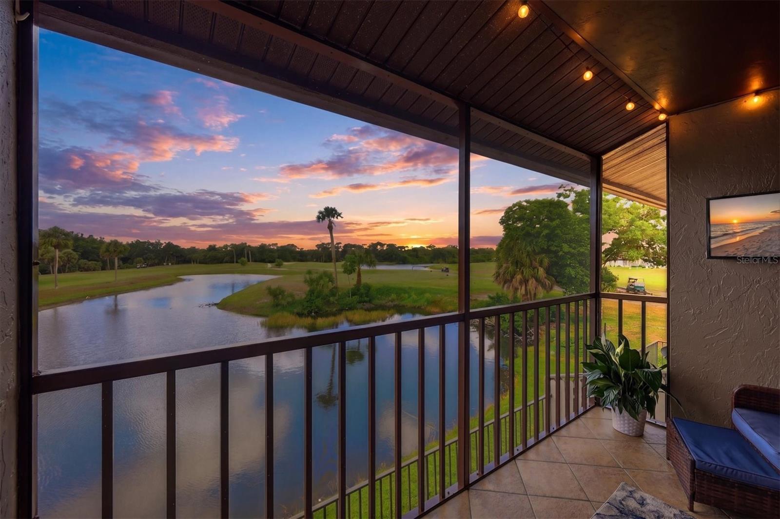Your perfect Florida escape awaits. Located in the Par Four community overlooking the Capri Isles Golf Course, this turnkey furnished and beautifully updated Venice Florida condo offers the kind of view others wait years to find.

From the second-floor lanai, the elevated western-facing views create incredible sunsets nearly every evening, while the scenery changes throughout the day between golfers passing through the 17th and 18th holes, wildlife gathering around the lake, and the peaceful backdrop of the course beyond. From sunrise coffee to sunset skies, the lanai quickly becomes your favorite place in the home.

Inside, vaulted ceilings and expansive sliders fill the living space with natural light and frame the incredible golf course and water views beyond. Beautifully furnished in a clean coastal style, the condo feels bright, welcoming, and instantly relaxing.

The renovated kitchen offers beautiful granite countertops, updated cabinetry, newer stainless appliances, generous prep space, and bar seating ideal for casual everyday living or entertaining guests. Luxury vinyl plank flooring and tile run throughout the home with absolutely no carpet. The bathroom has just been completed with a brand-new walk-in shower and glass enclosure, while the primary bedroom connects to its own private vanity and sink area for added comfort and functionality. Additional updates in recent years include a newer washer and dryer, updated plumbing with re-piping, and extensive interior renovations throughout, creating an easy, move-in-ready lifestyle from day one.

Designed for easy living without sacrificing scenery, this Venice golf course condo works beautifully as a full-time residence, seasonal Florida condo, or perfect winter escape. Quiet, convenient living is paired with easy access to Venice Island, Gulf beaches, shopping, dining, golf, and the Sarasota Memorial Hospital Venice campus.

Easy to maintain, easy to leave, and even easier to enjoy.

The Par Four community offers a heated pool, clubhouse with fully equipped kitchen, assigned parking, and additional storage. Whether gathering with neighbors, hosting visiting family and friends, or simply enjoying a relaxing afternoon by the pool, the community is designed to make everyday living feel effortless.

The HOA includes cable, water, sewer, and trash, and the association is financially sound with strong reserves. Plus, with no CDD fee, no flood insurance requirement, and no flooding damage from recent storms, ownership becomes even more manageable and stress-free.

Quiet mornings with coffee overlooking the water. Evenings spent watching the sunset from your lanai. This is the kind of condo that reminds you why everyone moves to Venice in the first place.