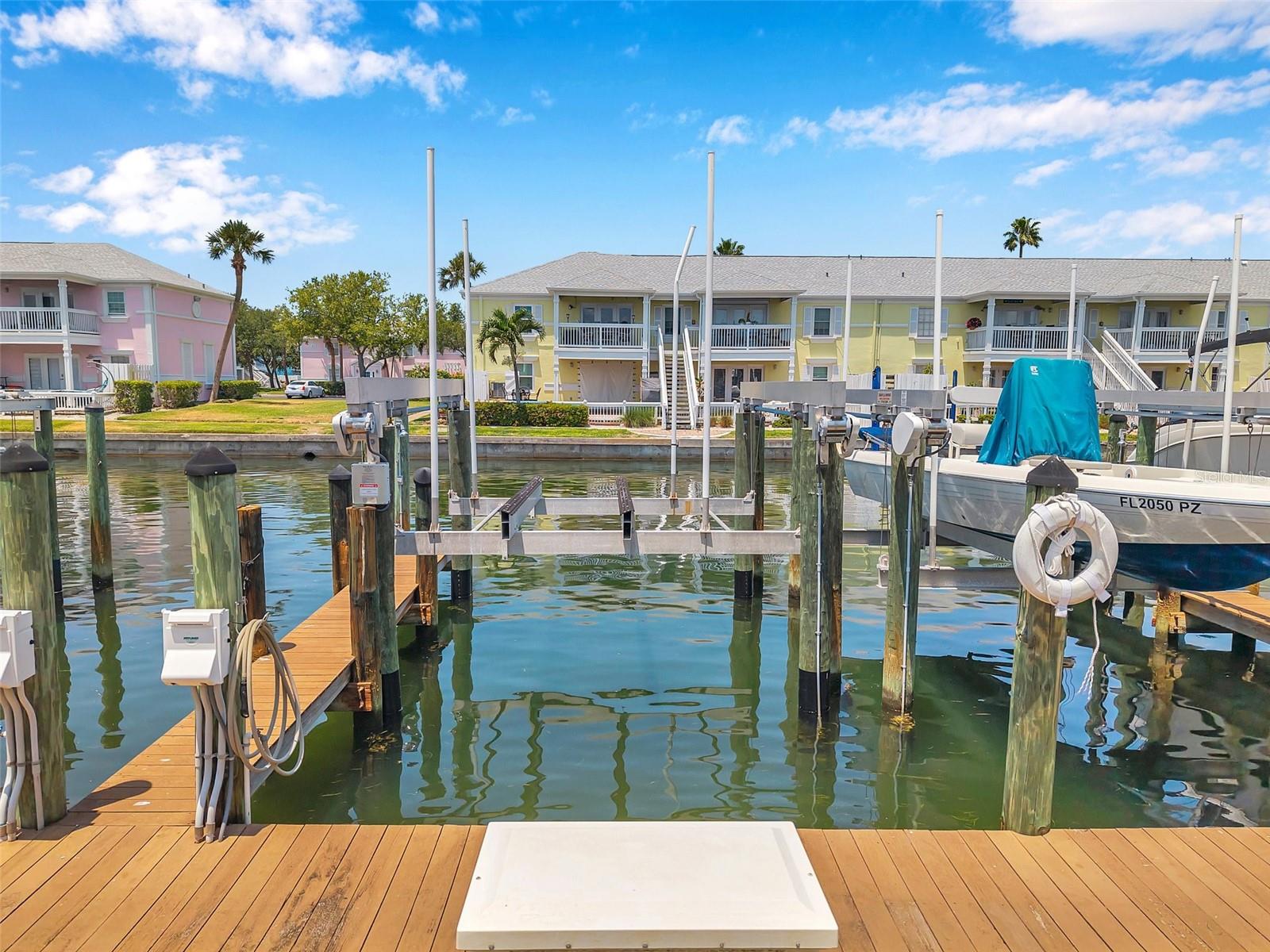 Deeded Boat Slip #114SS with 13,000 lb lift available for sale in the gated waterfront community of Waterside at Coquina Key South, located on Canal 4 along Coquina Key Dr SE. Prime slip location between Buildings 27 and 28. Ownership restricted to Waterside at Coquina Key condominium owners.

Slip accommodates vessels up to 30 feet in length and offers direct, unrestricted access to Tampa Bay and the Gulf  with no tidal restrictions for launch or recovery. Deep-water canal location provides convenient maneuverability and quick access to open water.

Equipped with a 13,000 lb Deco Power Lift (installed 2020), stainless steel motors, Tech II remote control system, and dock storage box.

HOA fee includes water, electricity, dock maintenance, and dock insurance.

Rare opportunity to secure a well-located, high-capacity boat slip within one of St. Petersburg’s premier gated boating communities.