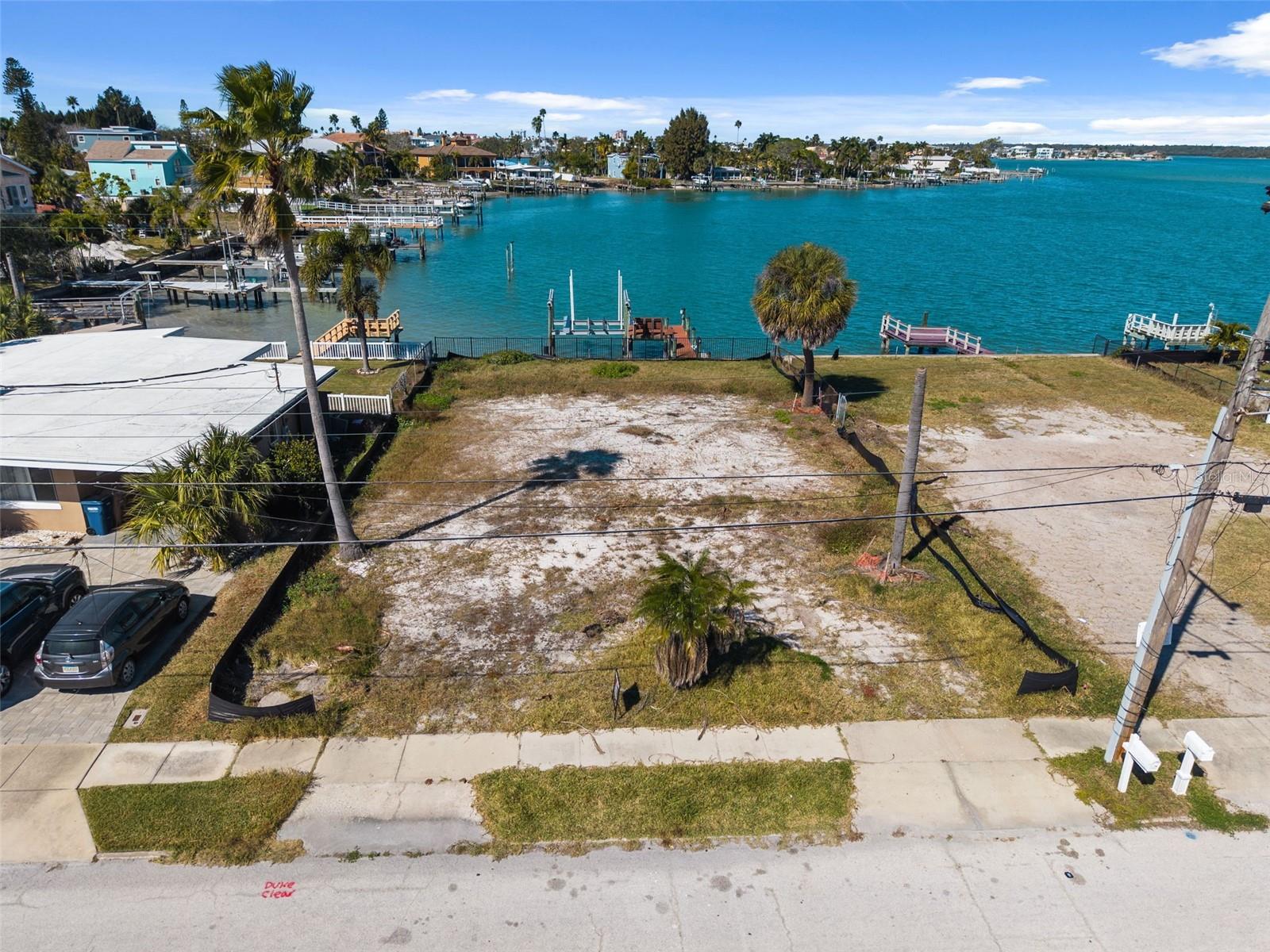 Unleash the potential of coastal living with this exceptional opportunity in a highly sought-after location just 0.3 miles from sugar-sand beaches and unforgettable West Coast sunsets. This waterfront parcel offers outstanding value and versatility, making it ideal for a custom dream home or a savvy investment.

The property is already enhanced with newer Trex decking, a newer seawall, and a 16,000-lb boat lift—providing a strong foundation for waterfront living from day one. Perfectly positioned just one street from popular restaurants, bars, and a grocery store, you’ll enjoy the rare combination of walkable convenience and relaxed coastal charm. Just steps away, the serene R.O.C. Waterfront Park offers green space and tranquil water views, further elevating the lifestyle appeal.

With its prime location, existing waterfront improvements, and proximity to beaches and amenities, this property represents a rare chance to capitalize on land value in one of the area’s most desirable neighborhoods. The possibilities are endless—bring your vision and create your own coastal retreat.